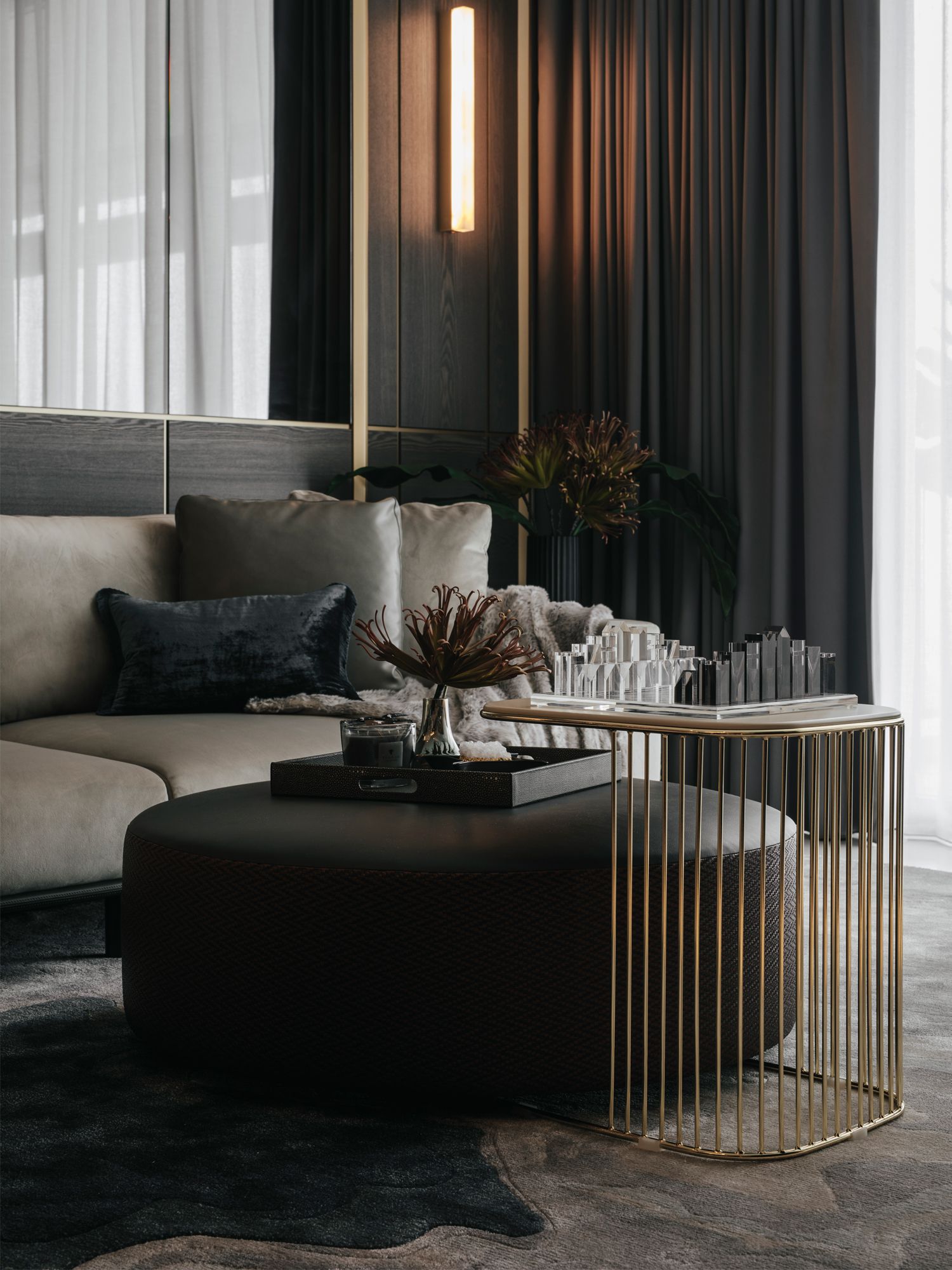 The living area of the Night unit is a handsome space in neutral tones elevated by dark blue accents