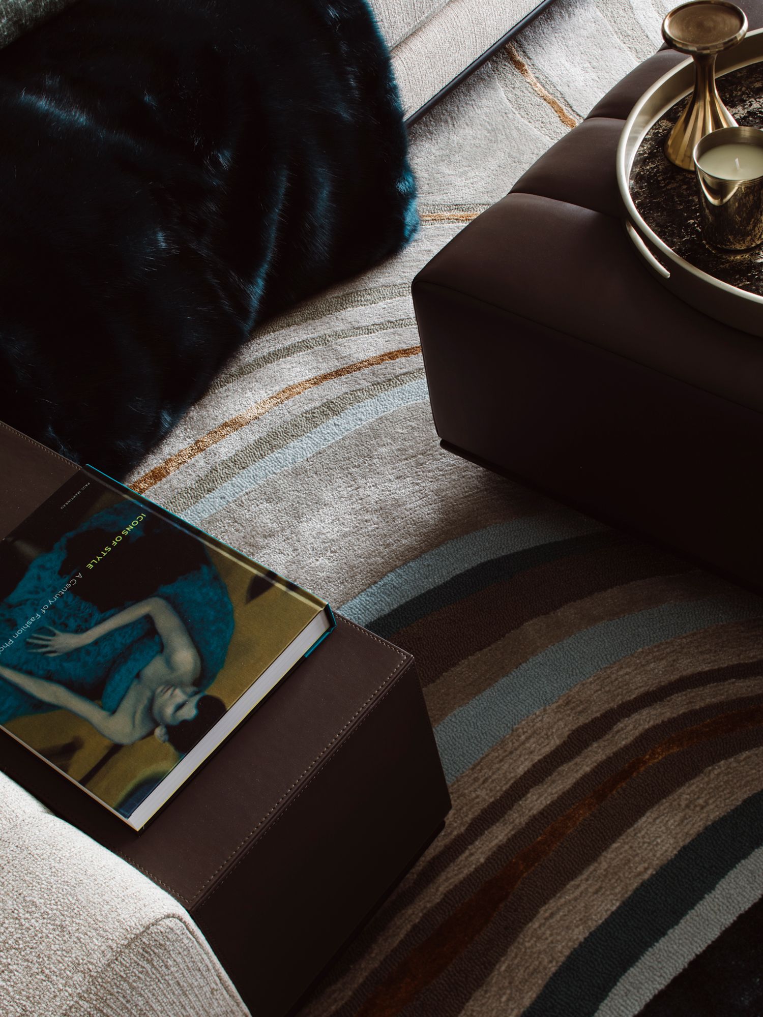 The blue tones in the living room rug emulates the curves of ocean surface waves
