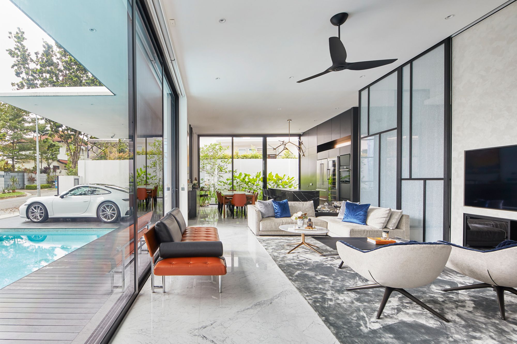 The bright, breezy living area is furnished with sofas from Poliform, a Porada console and a JAB Anstoetz daybed