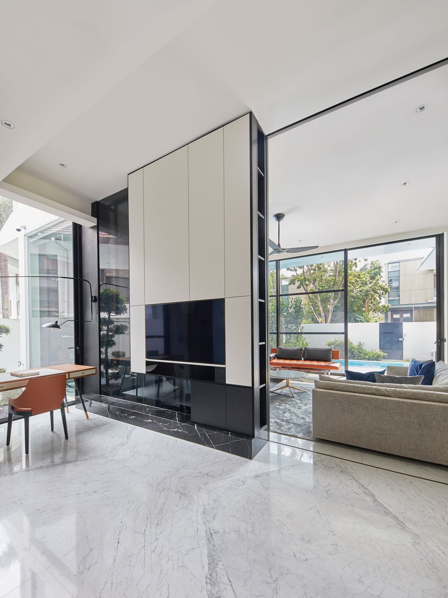 A view of the playroom and living area with the sliding glass doors concealed