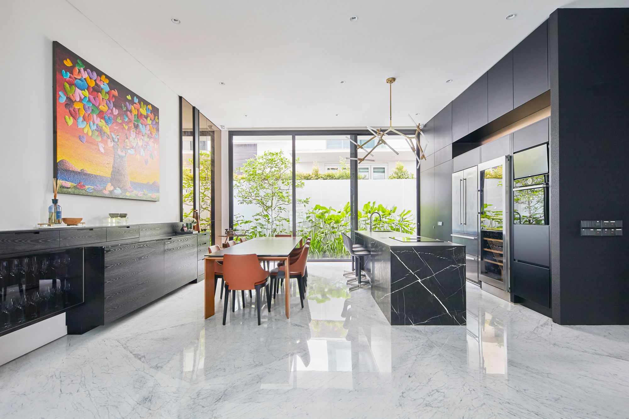 The dining area features a customised sideboard that is perfect for the narrow space