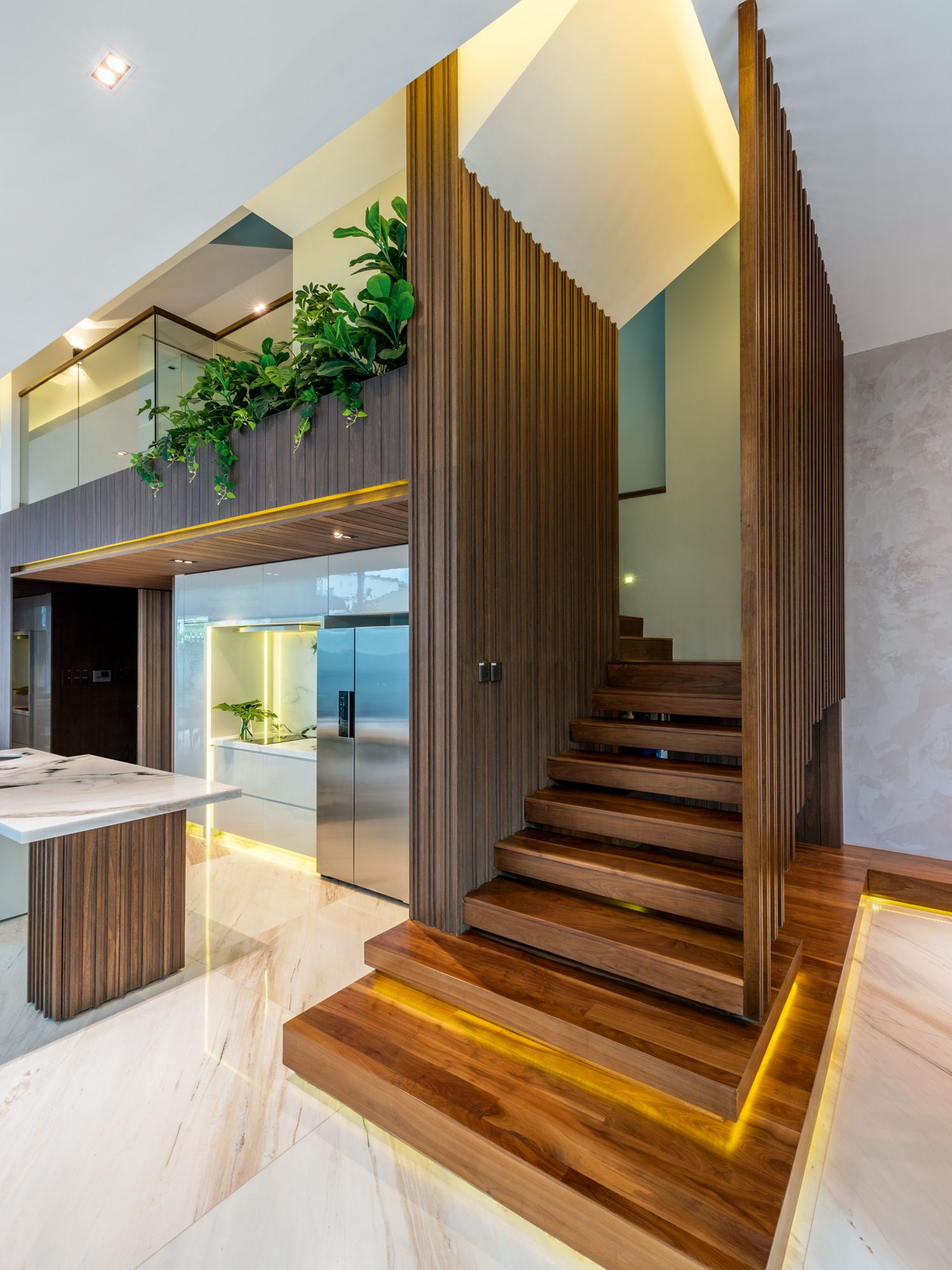 The cantilevered staircase is the focal point of the open-plan layout on the ground floor
