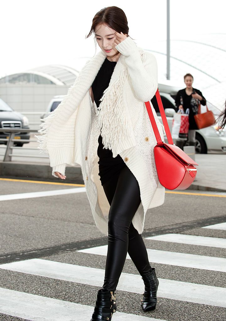 Airport fashion: Ankle boots and fur cardigans seem to be a favourite of the actress. : Getty Images
