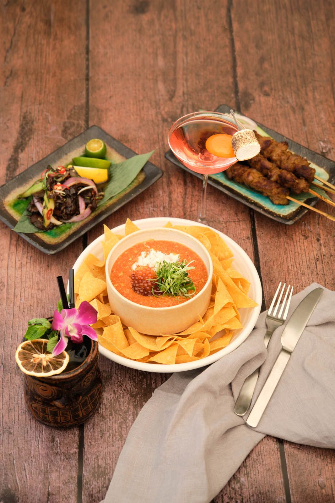 Chilli crab nachos and satay made of Iberico pork chunks
