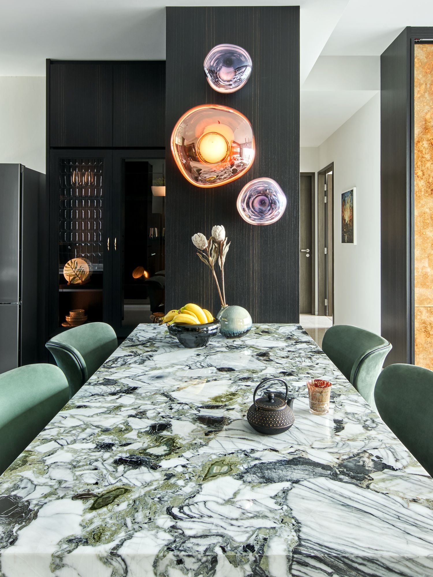 The white marble dining table forms the focal point of the dining area
