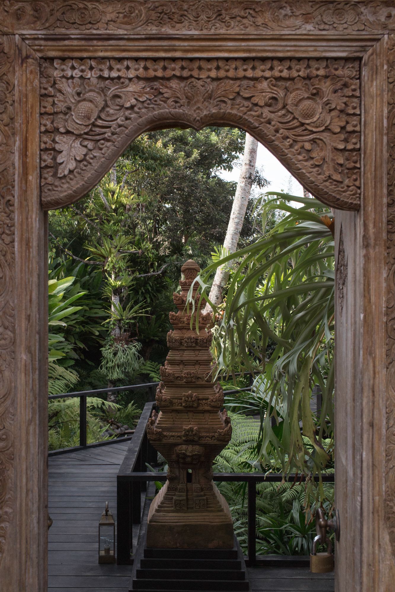 The entrance of the home features traditional Balinese elements
