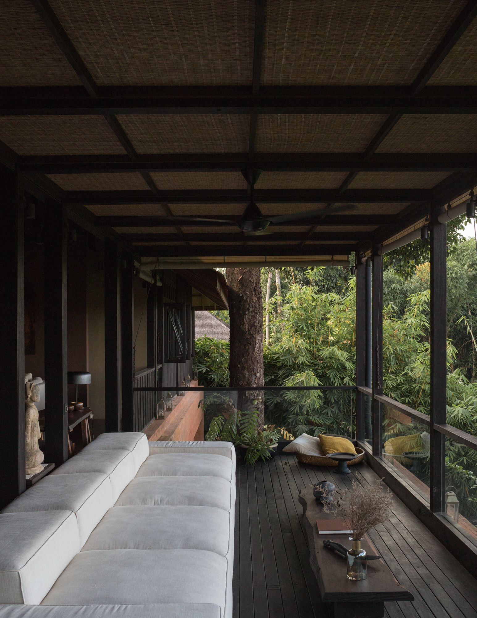 The linen-fitted sofa forms an alternate communal space for the family to relax