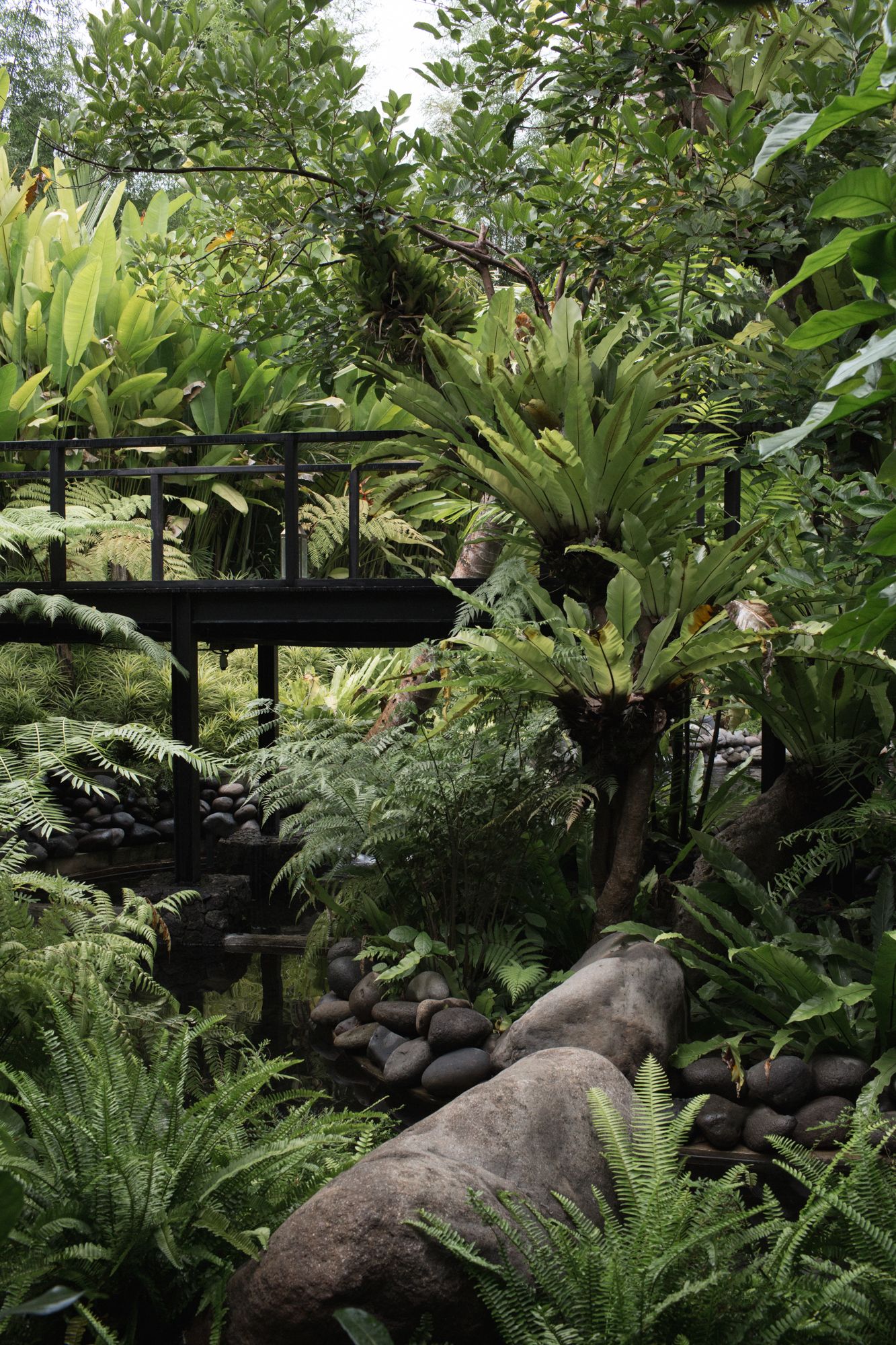 The villa is surrounded by a lush landscape and garden created by interior designer Maximilian Jencquel