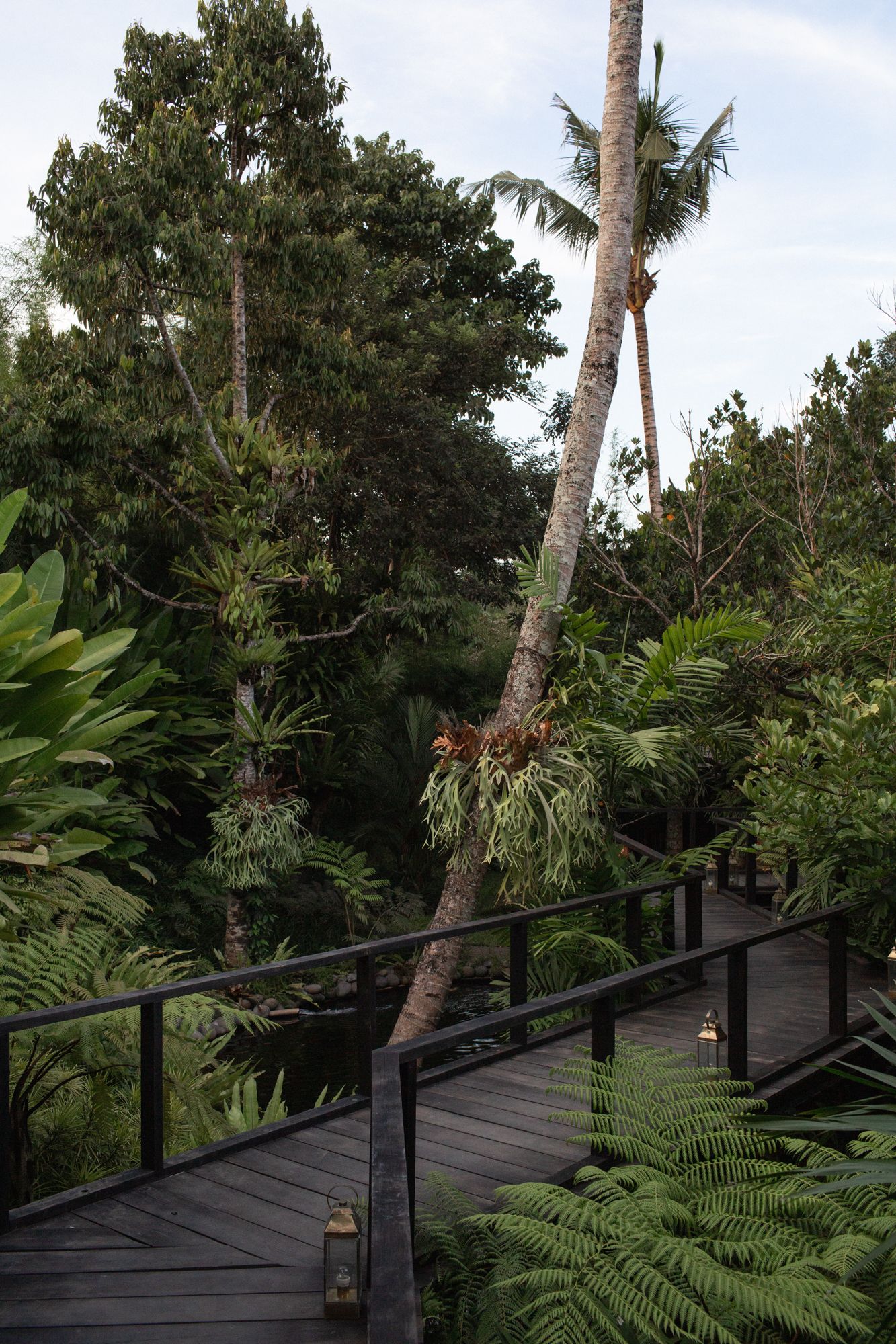 A winding bridge leads the way to the home, formed in a zigzag pattern to ward off unwanted spirits
