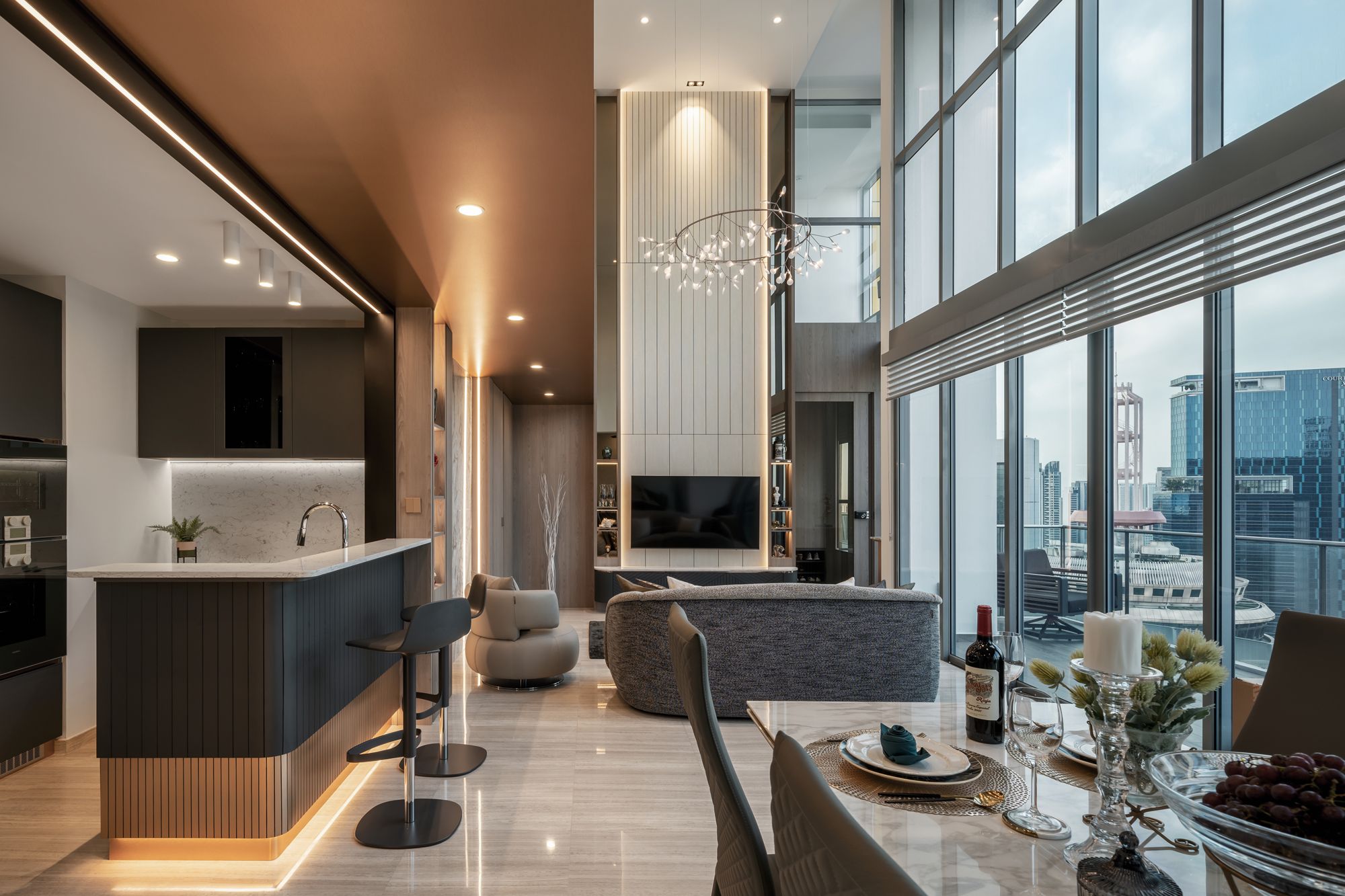 The vertical panels on the feature wall draw attention to the lofty height of the living area