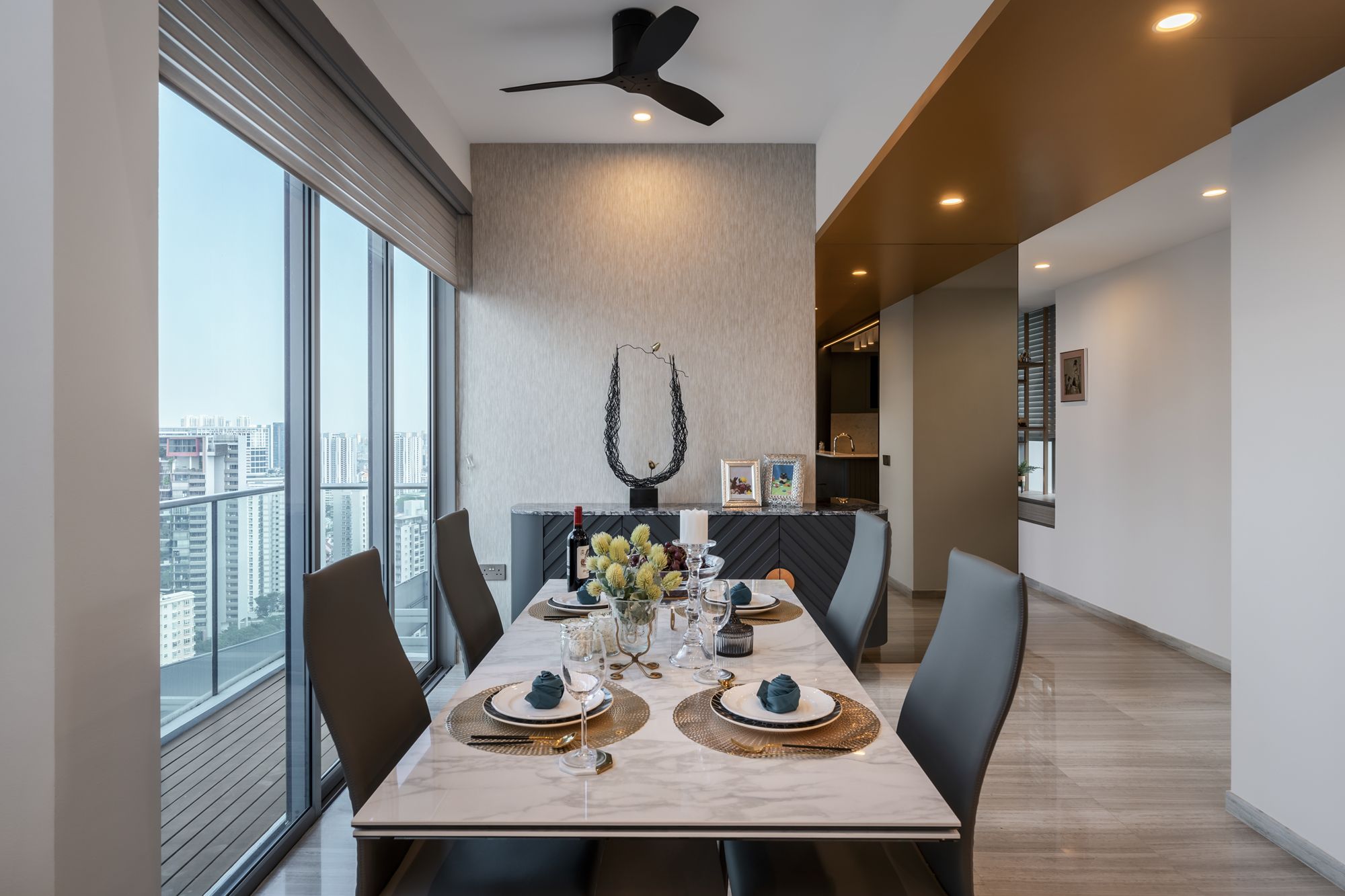 The dining area features a spectacular view of the city skyline