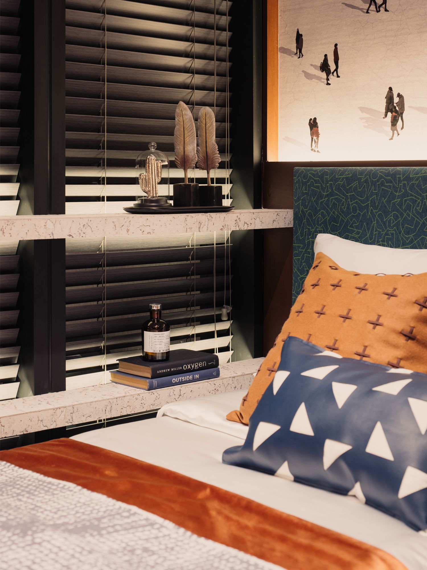 The bedroom features an interesting mix of patterns and colours