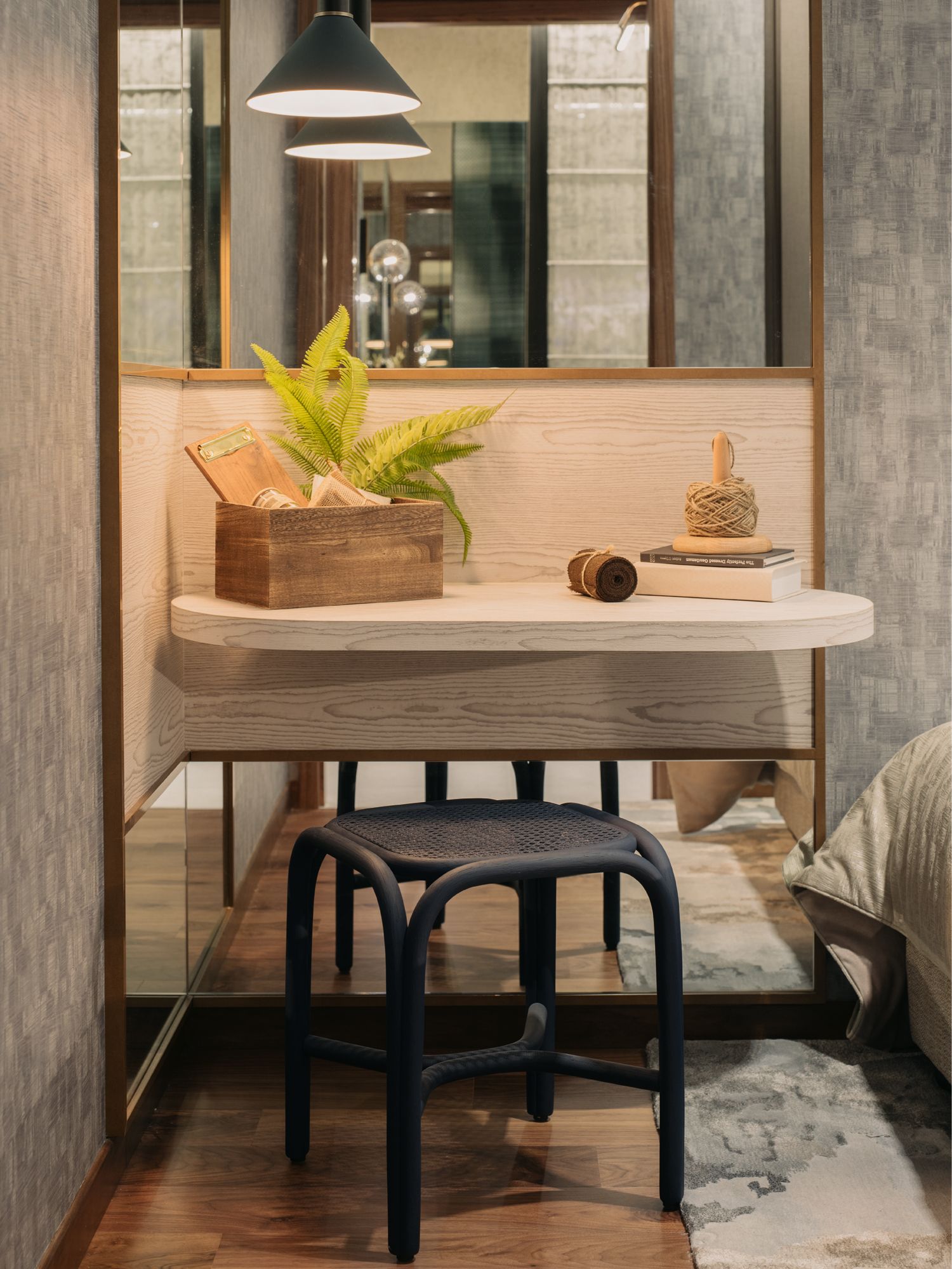 A set of mirrors creates an infinity effect in the dressing area