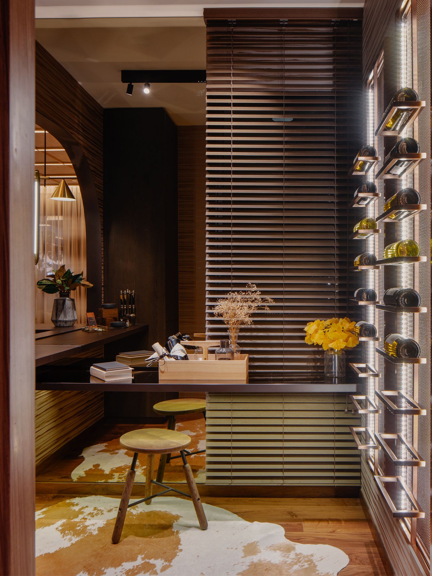 A cosy counter and seat in the wine room adds a relaxed ambience to the space
