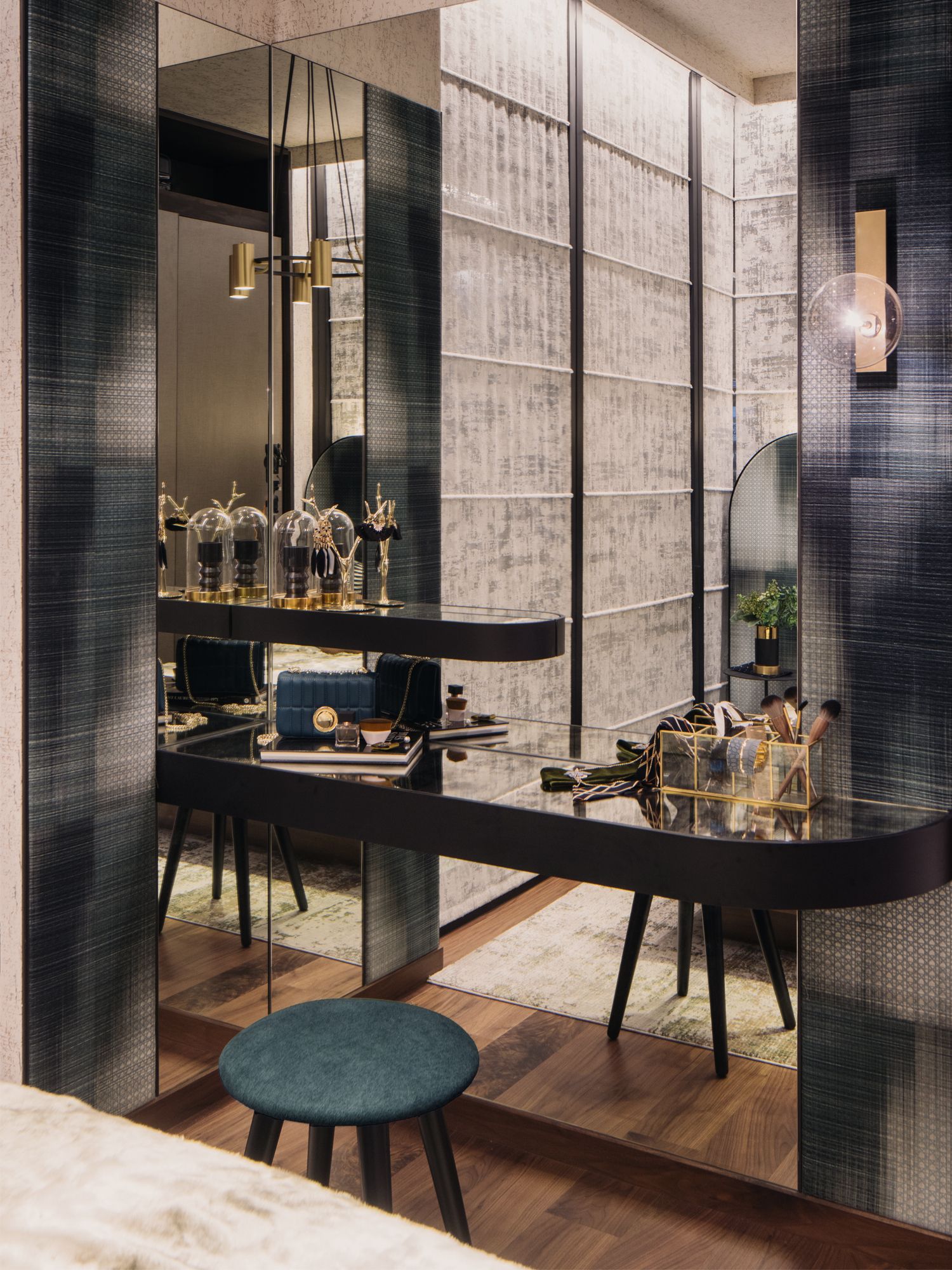 The master bedroom features glamorous textural walls and a rounded vanity table top