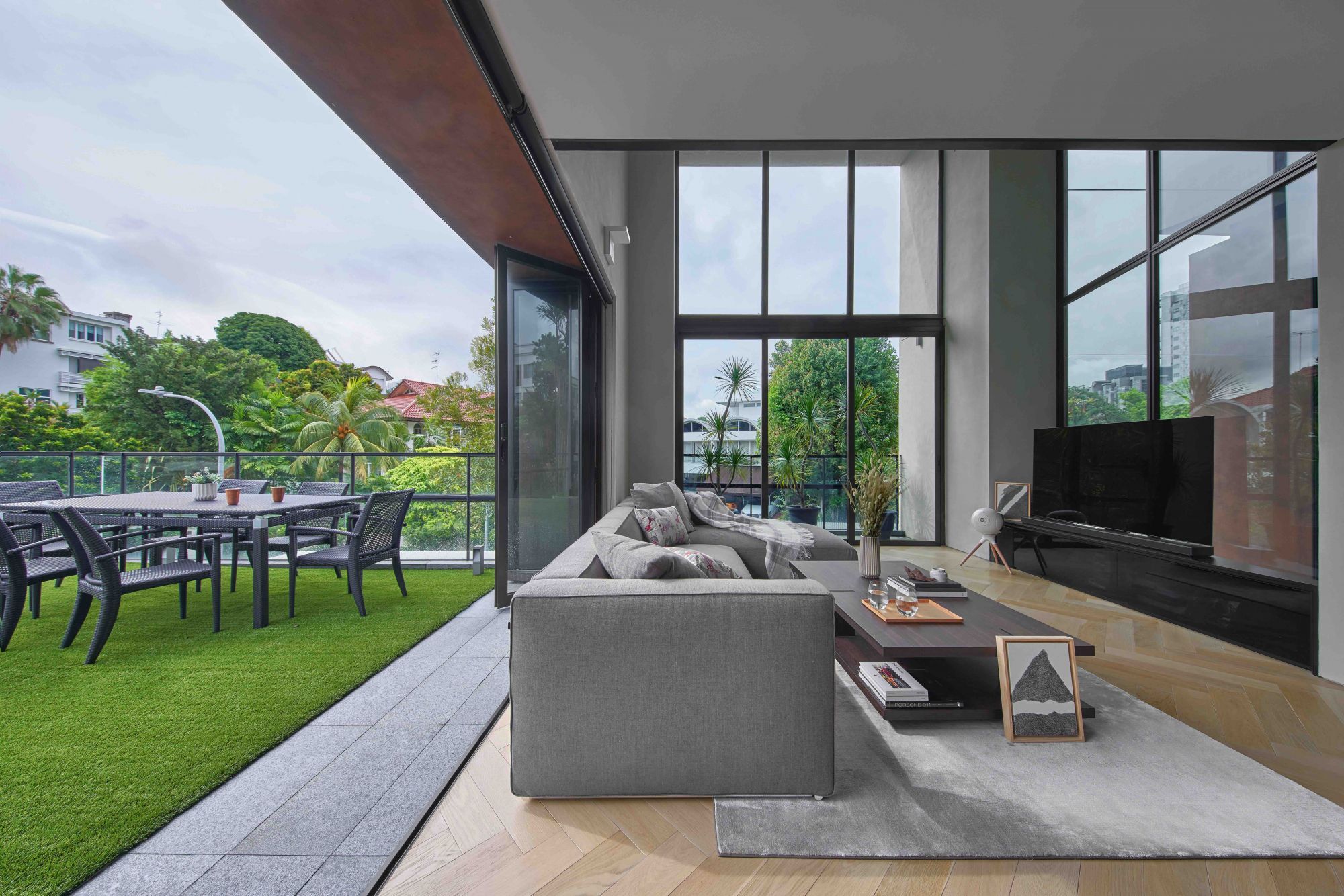 This rooftop balcony, designed by Park + Associates, connects seamlessly to the living room with a harmonious flow Photography: Jasper Yu
