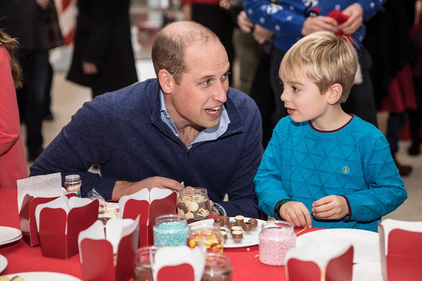 Prince William sits with Harry O'Grady as they make chocolate truffles as he takes part in a children's pretend snow ball fight during a Christmas party to deliver a message of support to deployed personnel serving in Cyprus and their families over the festive period. Photo: Richard Pohle - WPA Pool/Getty Images