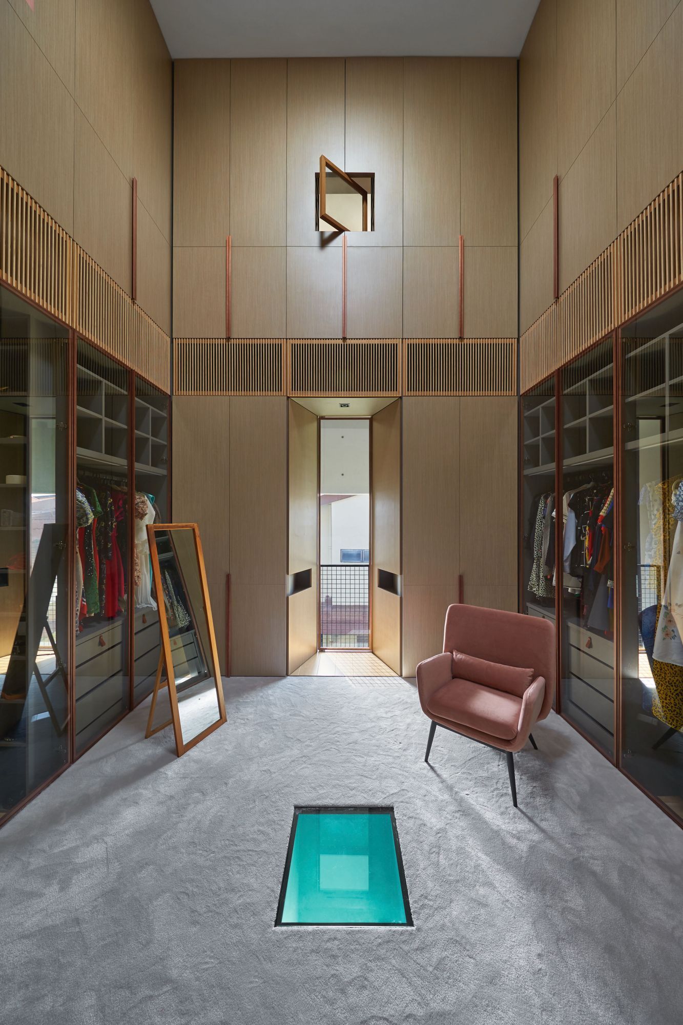 Designed by Rene Tan, co-founder of RT+Q Architects, this walk-in wardrobe features lofty ceilings that create a bright and airy atmosphere
