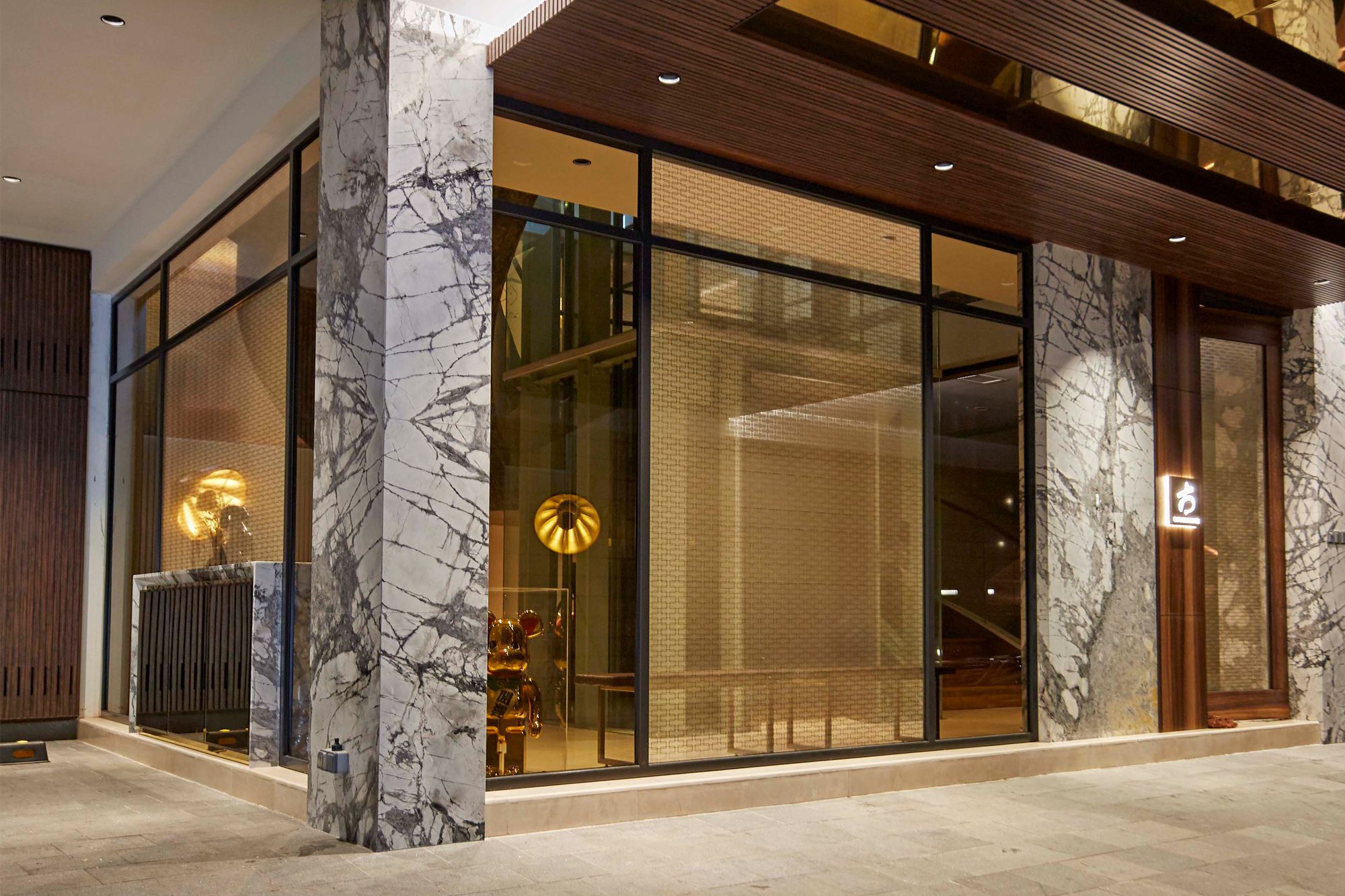 The basement entrance of the home features a logo signage the features the owner's family name