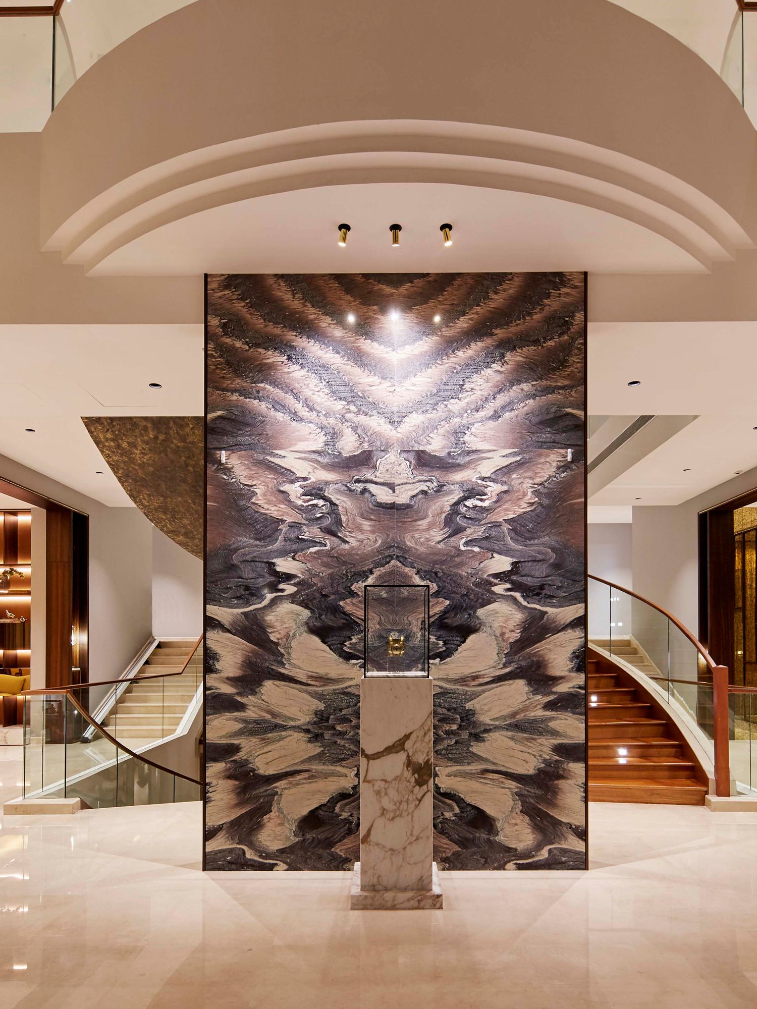 Guests are greeted with a Corvidae marble feature wall in the foyer
