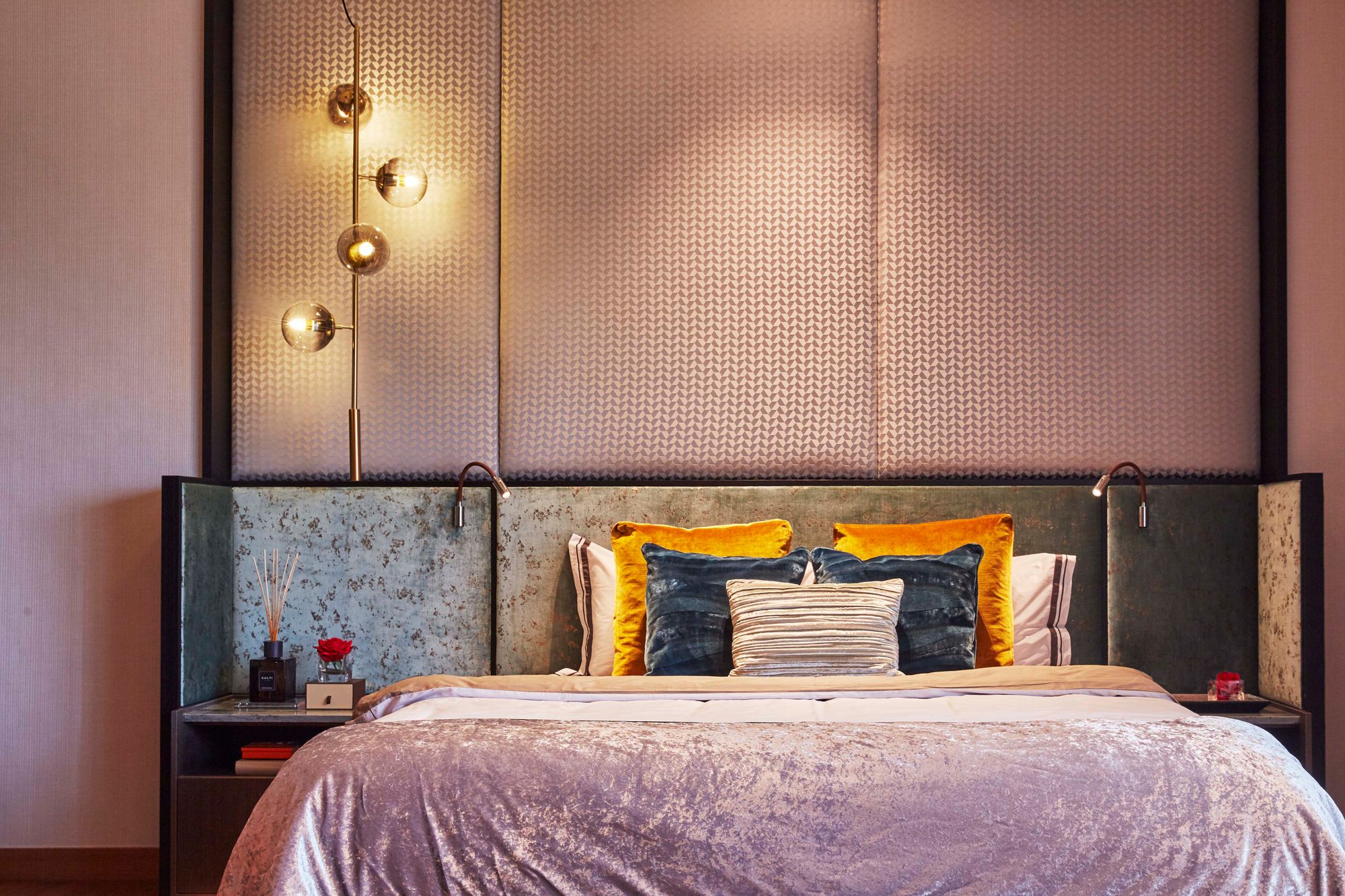 Each bedroom features a patterned and textured headboard against a feature wall
