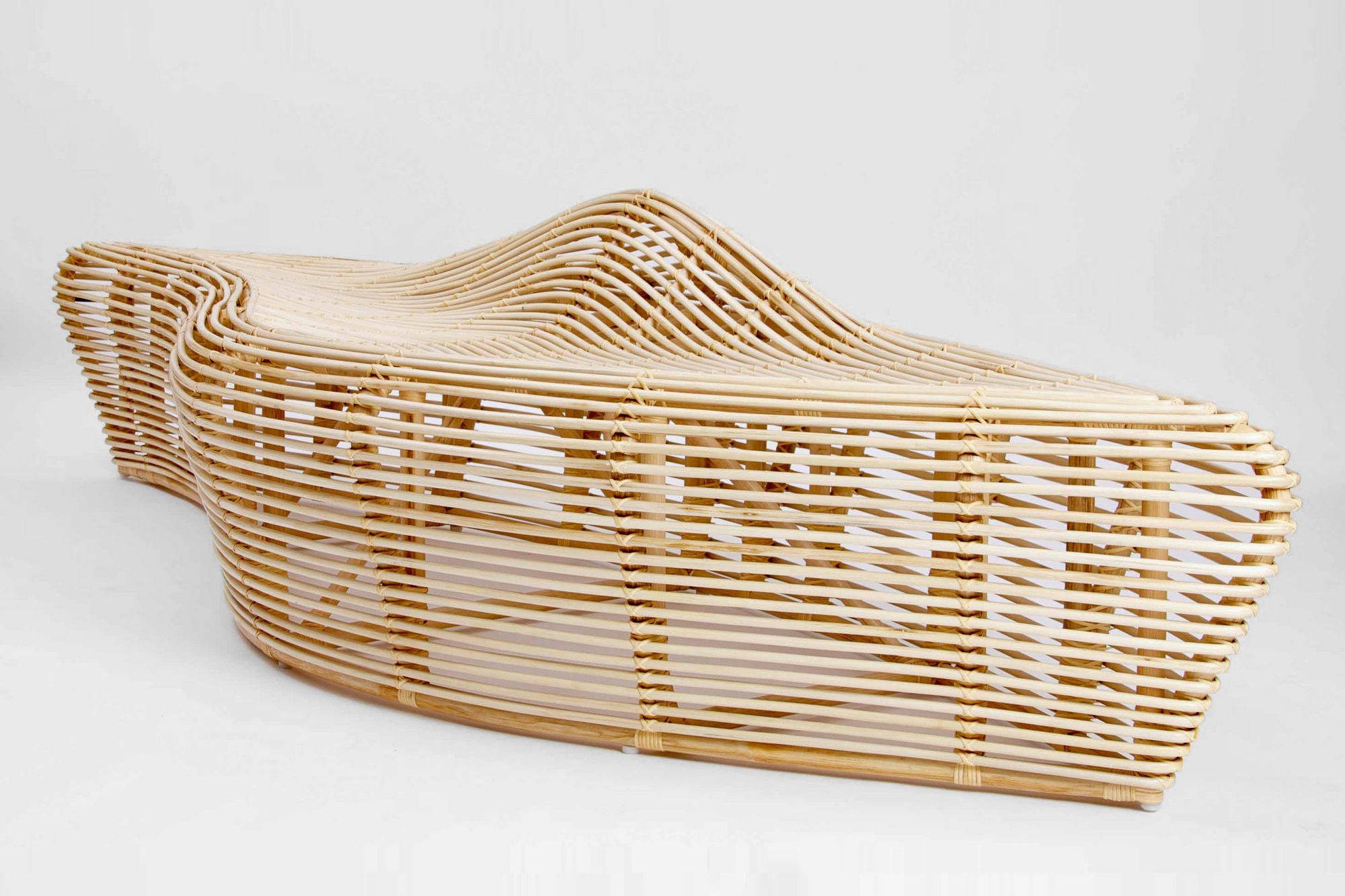 One of Tjitrowirjo's favourite pieces, the Linger Bench is designed to draw people to gather and experience the beauty of the natural rattan material
