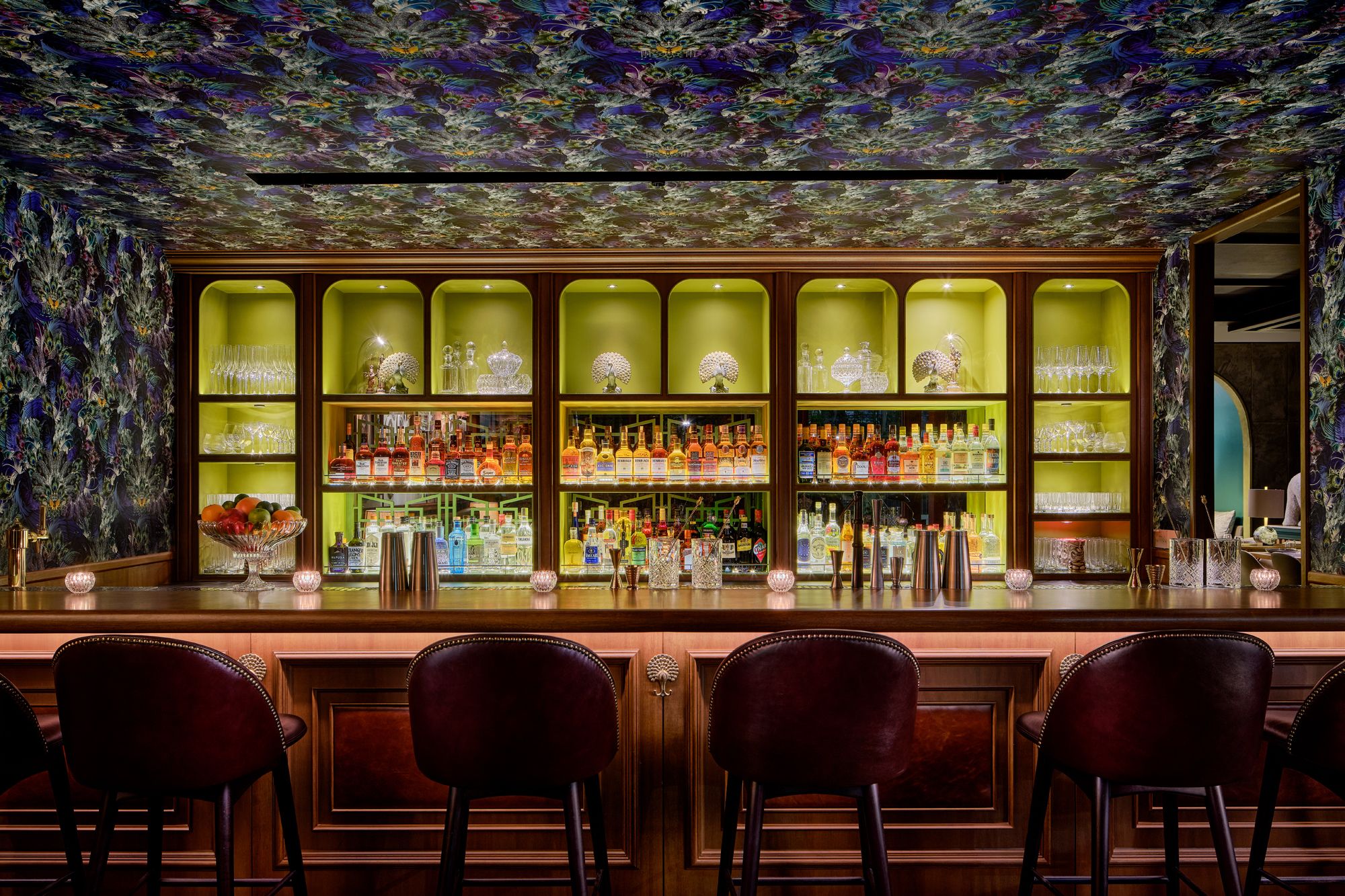 The Santorus peacock-themed wallpaper forms the visual focus in the dark and sultry bar Photo: Courtesy of Firangi Superstar