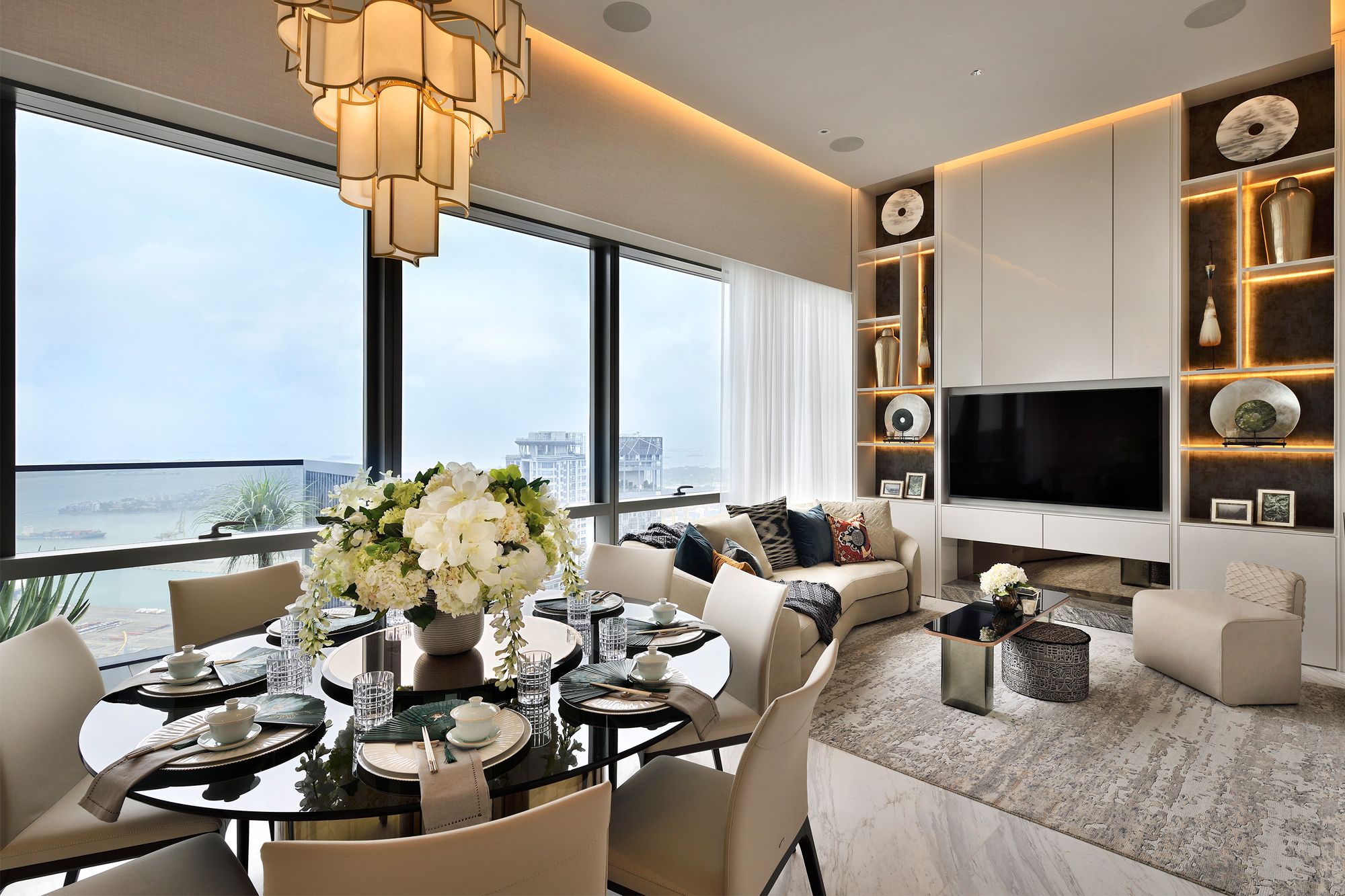 An elegant apartment accentuated by layers of off-white furnishings and styling elements