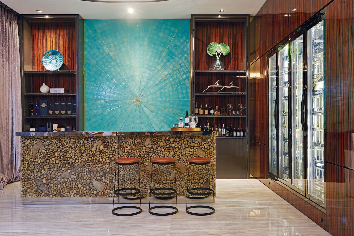 Elements such as this eye-catching aquamarine feature wall create a vibrant interior Photography: Koh Boon Wei/Beebox