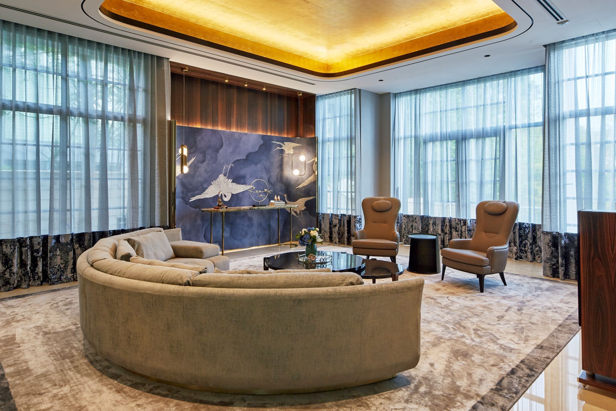 This GCB features a vibrant touches like this blue Philip Jeffries crane wall covering that add a pop of colour