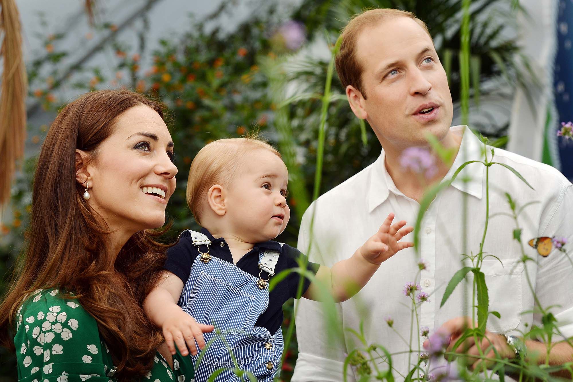 Catherine holds Prince George with Prince William while visiting the Sensational Butterflies exhibition at the Natural History Museum. This adorable family picture was taken ahead of the young prince’s first birthday and it is clear he was already so photogenic. (Photo: Getty Images)