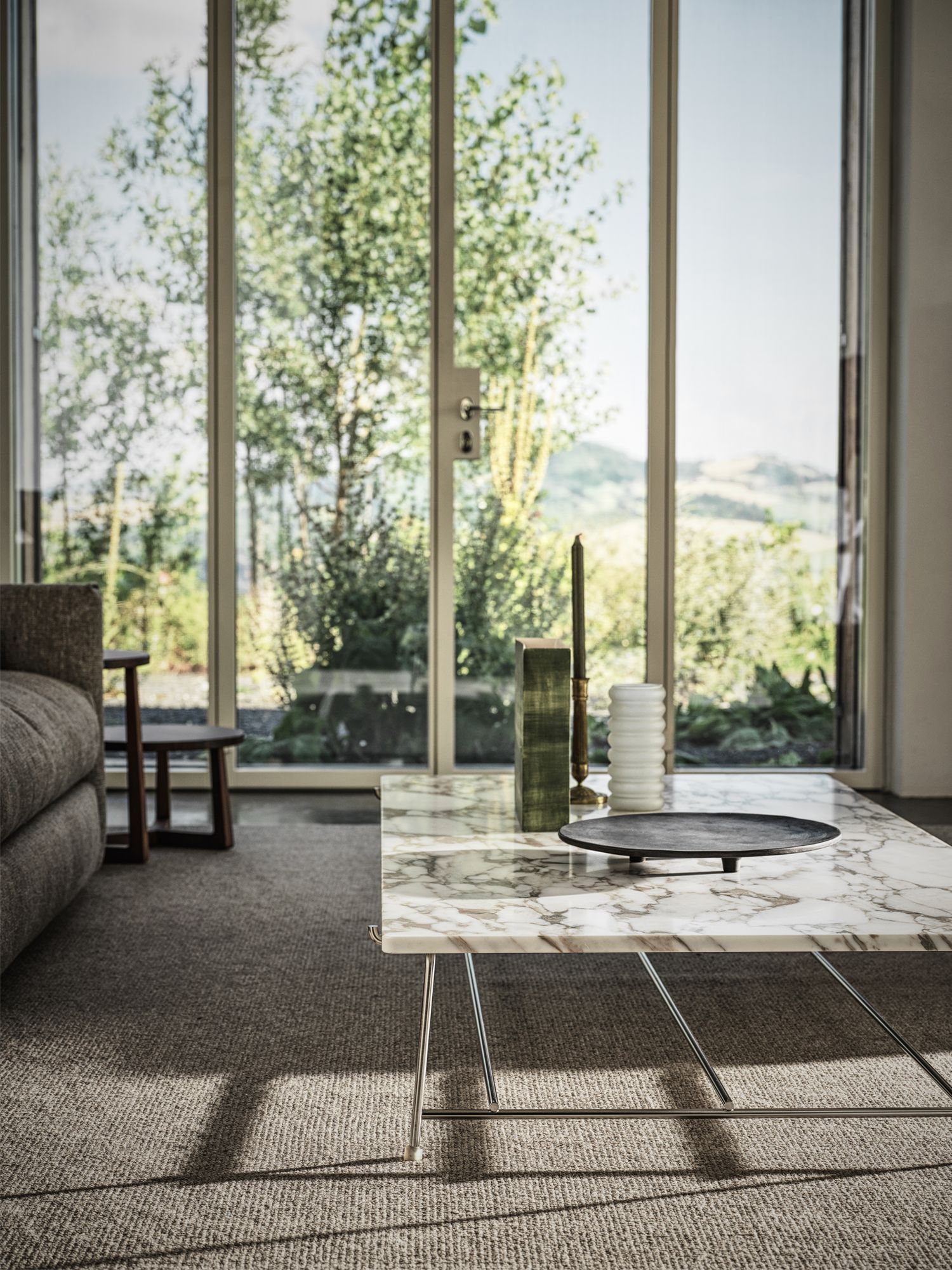 The Any Day coffee table by Christophe Pillet from Flexform adds an elegant touch to the living room