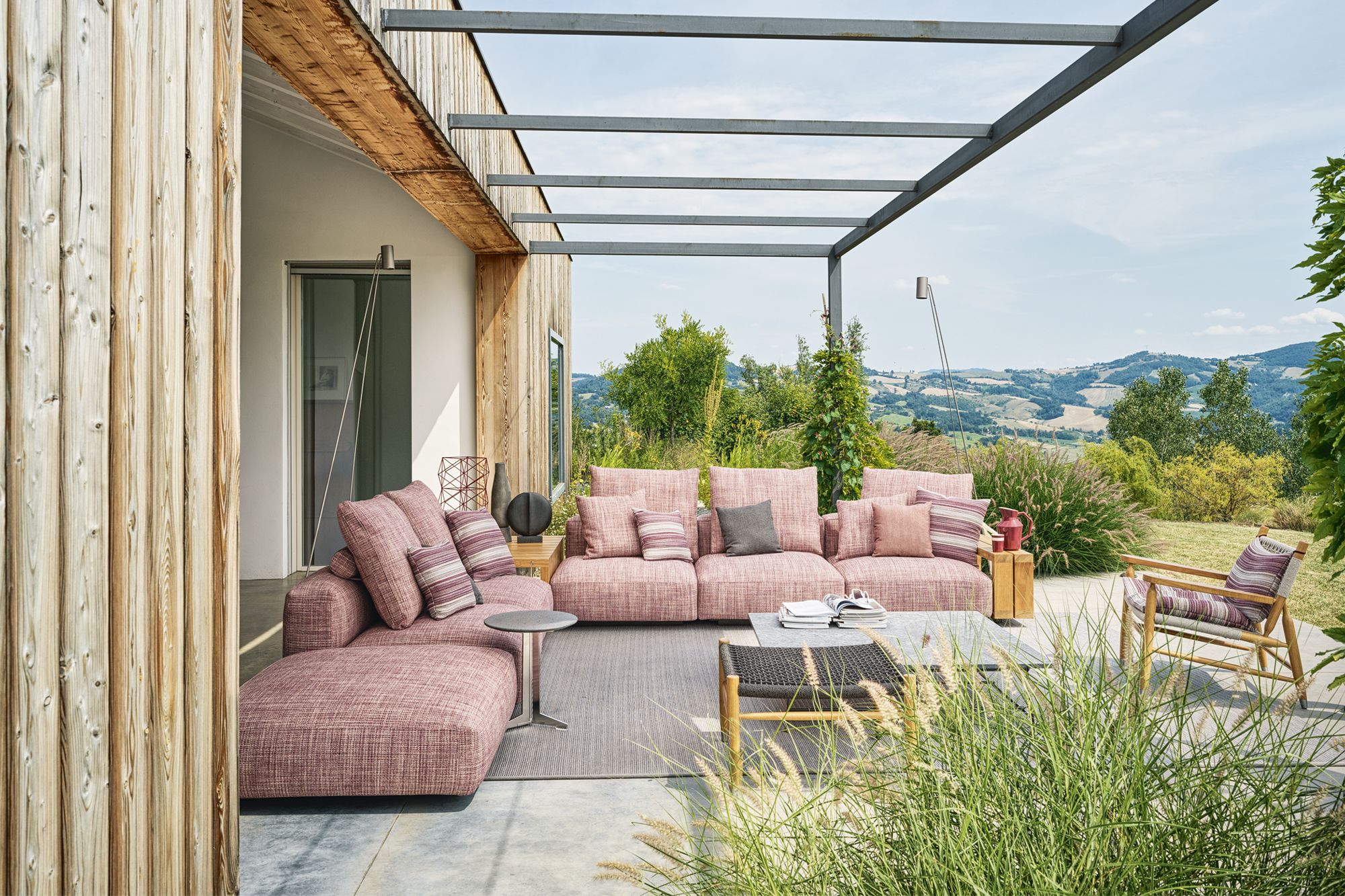 The Flexform Tessa armchair on the terrace is Donini’s favourite reading spot