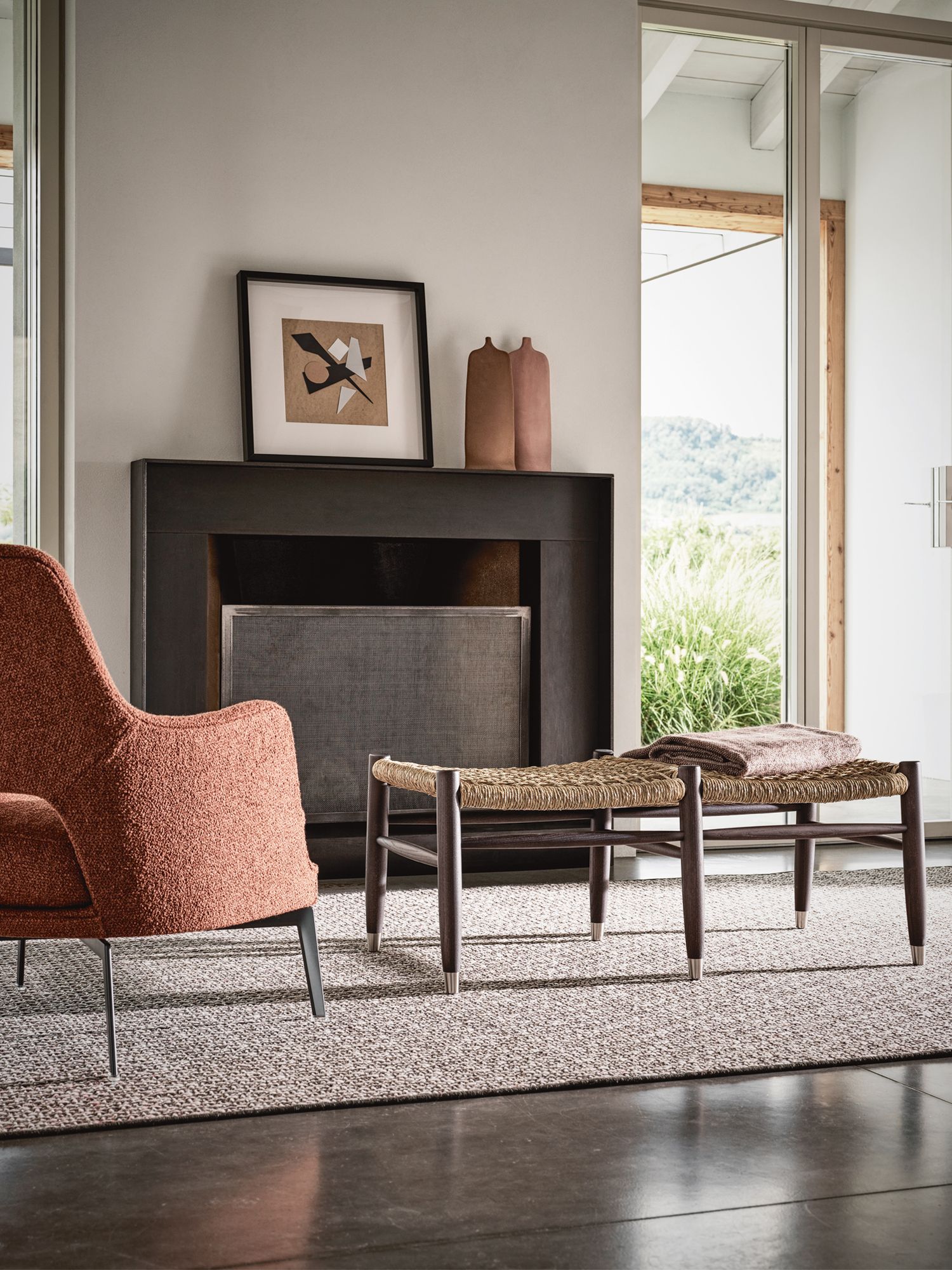 The rust and earthy tones of the furnishings contribute to the cosy ambience of the home