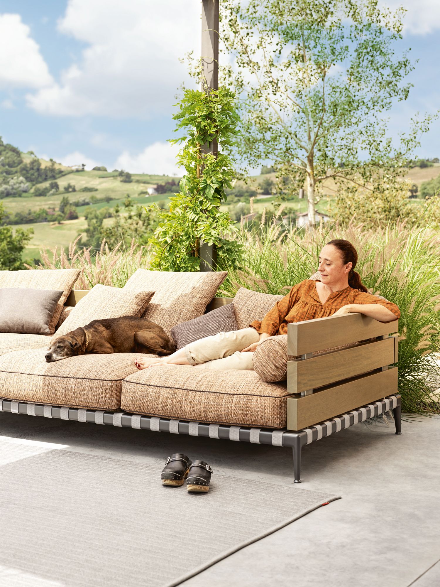 Homeowner Valentina Donini lounges with her dog