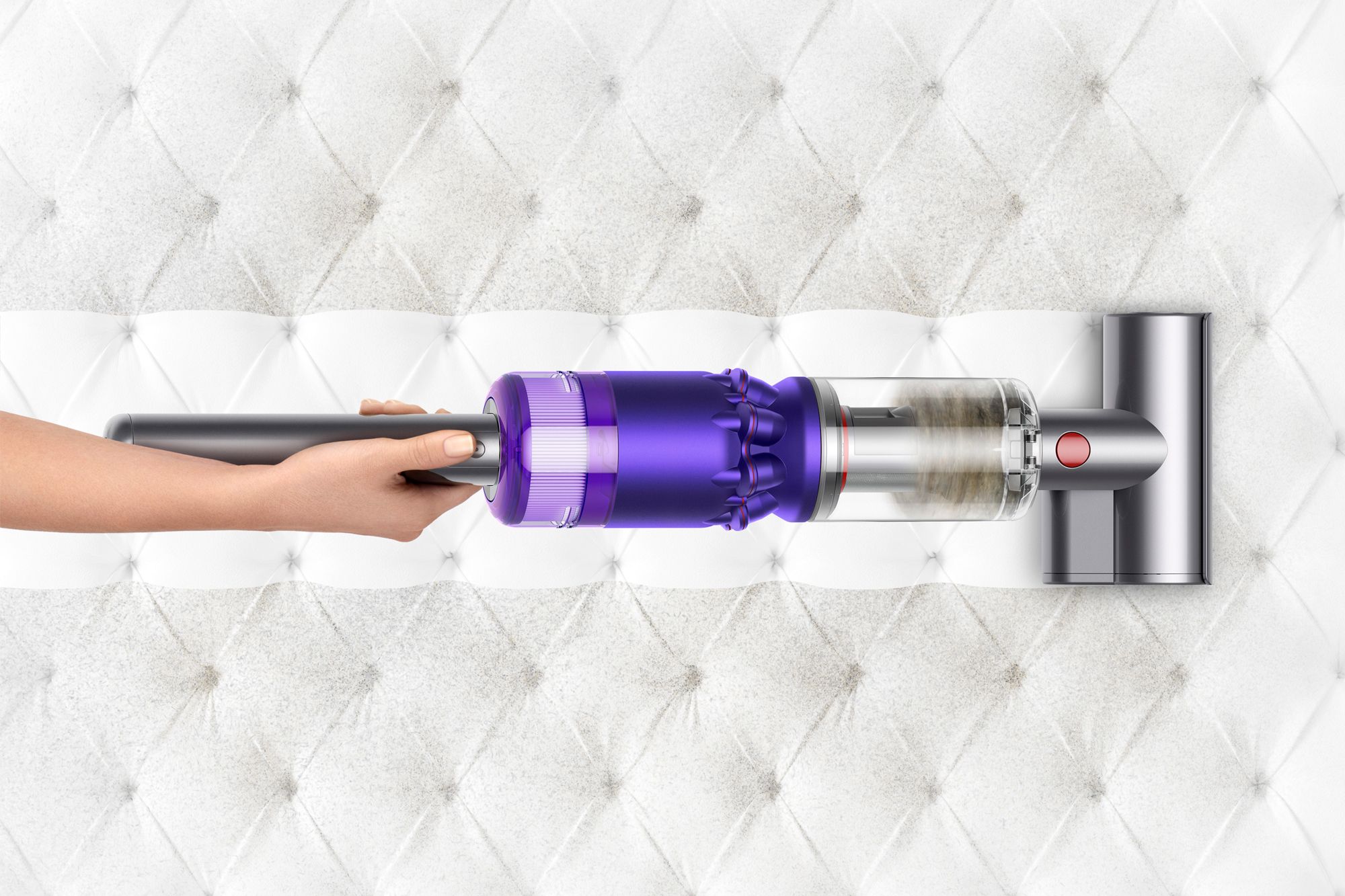 When cleaning fabrics, use an upholstery attachment as seen here on the Dyson Omni-glide, to suck up dirt and hair Image: Courtesy of Dyson