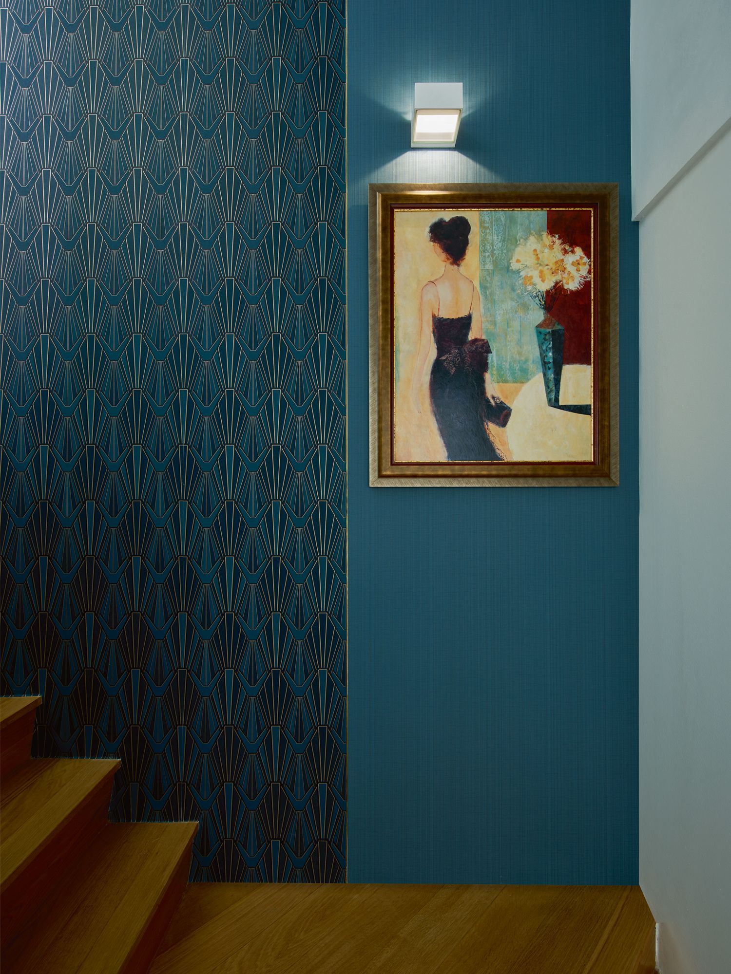 Emerald wall coverings from Tat Ming Wallpaper turn the staircase into a glamorous space
