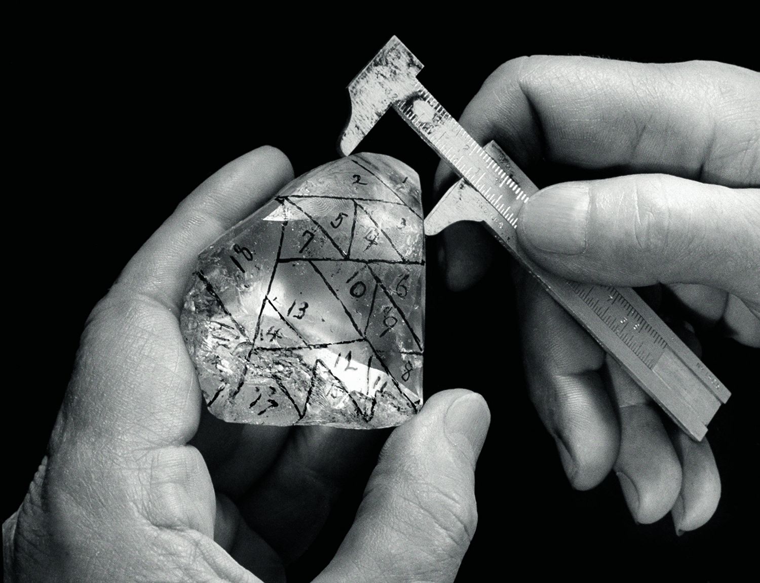 A diamond cutter takes measurements on a 726-ct. Vargas diamond, 1941. The black markings indicate different grains. (Photo by Herbert Gehr/Time Life Pictures/Getty Images)