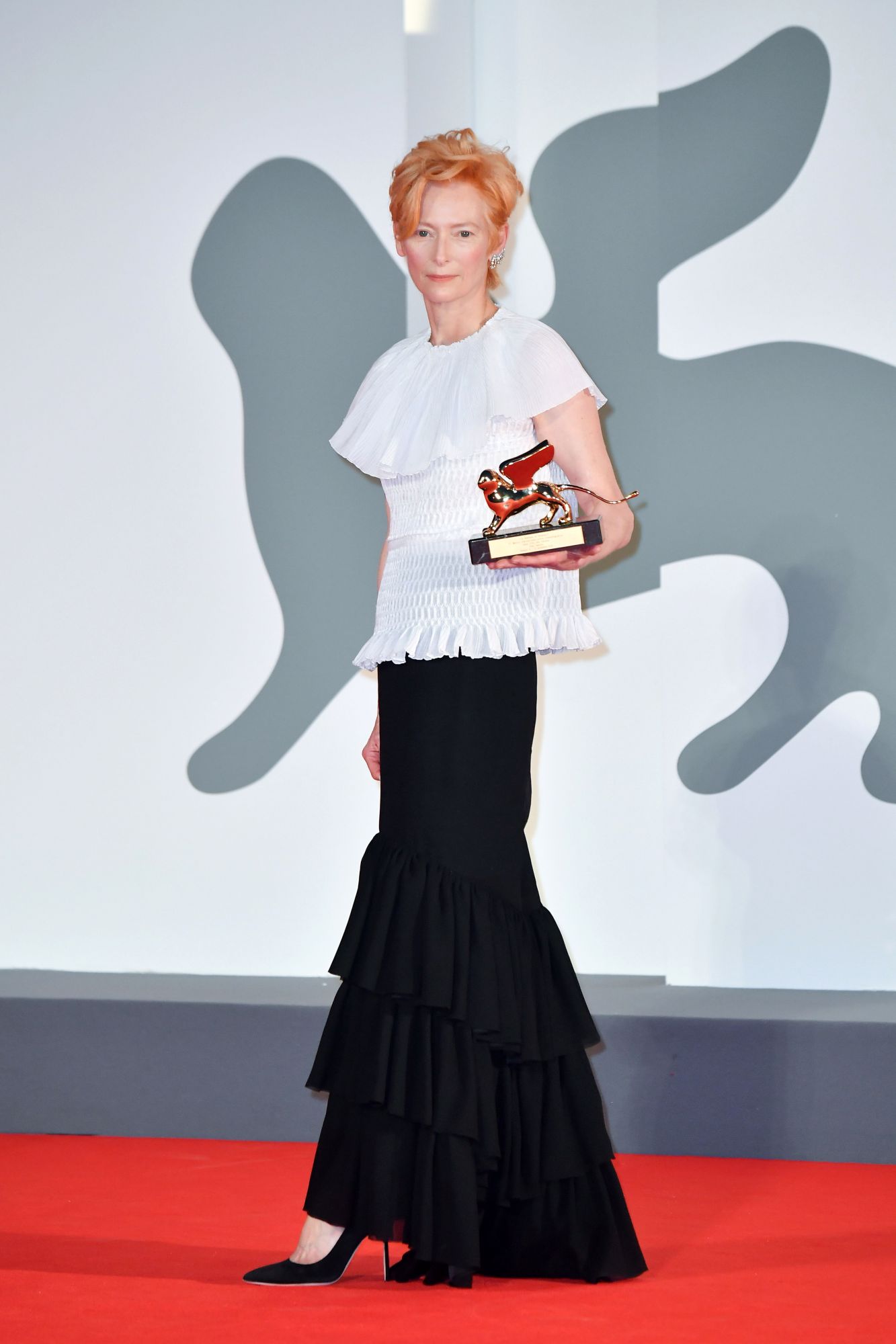 VENICE, ITALY - SEPTEMBER 02: Tilda Swinton poses on the red carpet with the Golden Lion Lifetime achievement award after the Opening Ceremony during the 77th Venice Film Festival at on September 02, 2020 in Venice, Italy. (Photo by Stephane Cardinale - Corbis/Corbis via Getty Images)