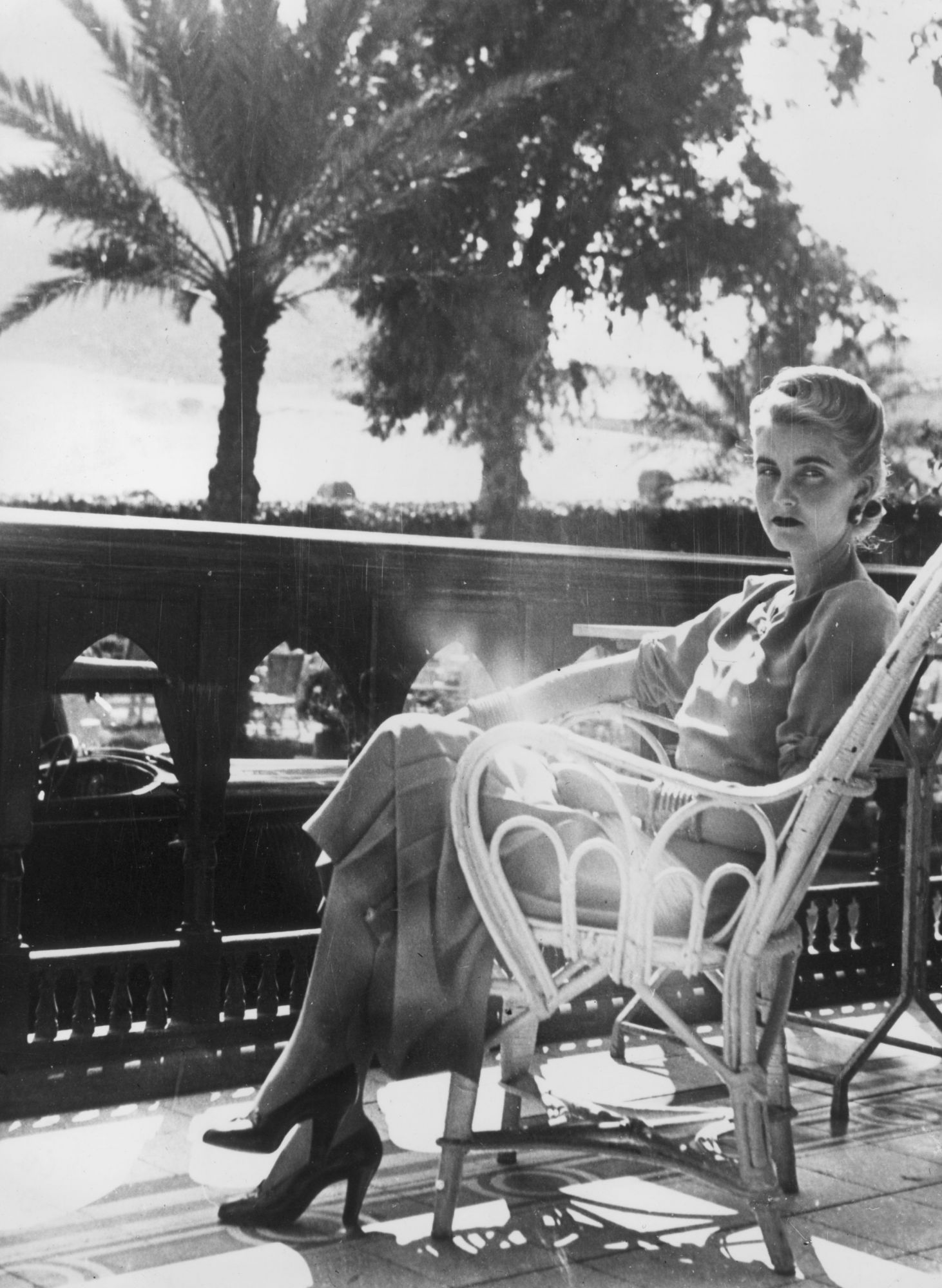7th February 1939:  American socialite and Woolworth heiress Barbara Hutton (1912 - 1979), the Countess von Haugwitz-Reventlow, relaxes on the balcony of the Mena House Hotel in Cairo, where she is spending a holiday.  (Photo by Keystone/Getty Images)