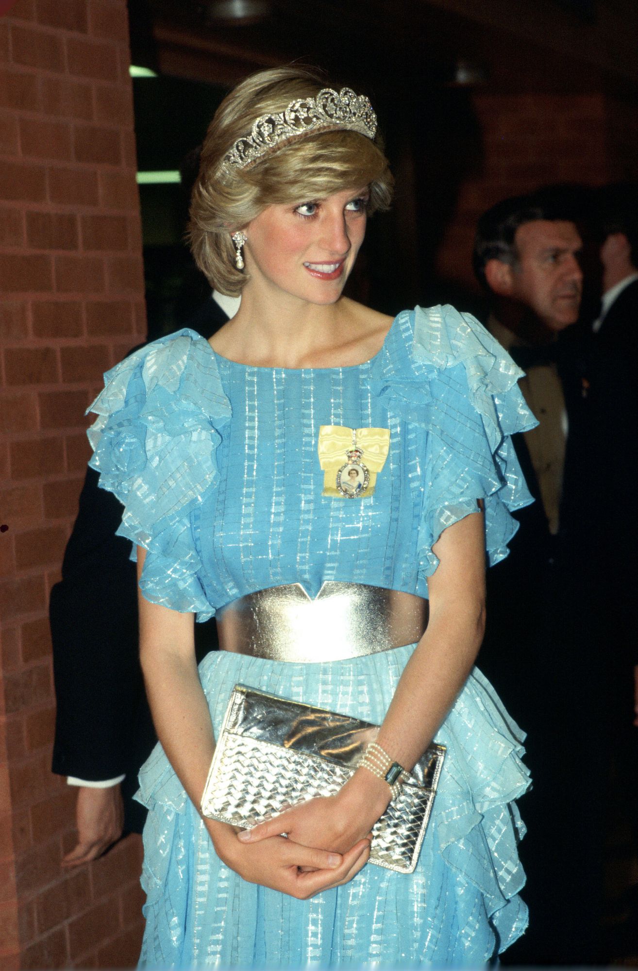 ST JOHNS, CANADA - JUNE 18: Diana, Princess Of Wales, Arriving For A Dinner Hosted By The Province Of New Brunswick. The Princess Is Wearing The Diamond Spencer Tiara. She Has Accessorized Her Pale Blue Evening Dress With A Broad Silver Belt And Silver Clutch Bag. Diana's Outfit Is By Fashion Designer Bruce Oldfield. (Photo by Tim Graham Photo Library via Getty Images)