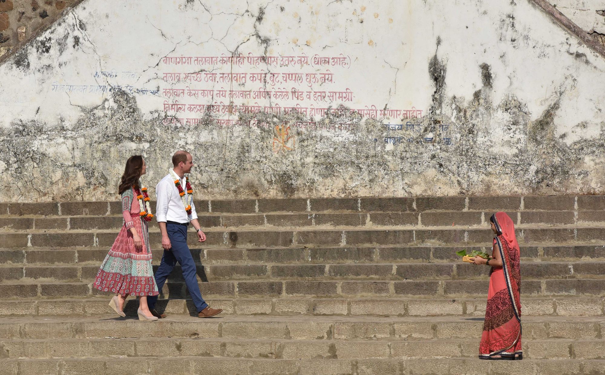 MUMBAI, INDIA - APRIL 10: Prince William, Duke of Cambridge, and his wife Kate Middleton at Banganga slums, both chatted to the slum's residents, who revealed that they had never been visited by celebrities or politicians before, during their royal visit to India, on April 10, 2016 in Mumbai, India. The Duke and Duchess of Cambridge paid their respects at one of the sites of the 2008 Mumbai terrorist attacks on Sunday as they began a weeklong visit to India. Prince William said his wife Kate Middleton wante