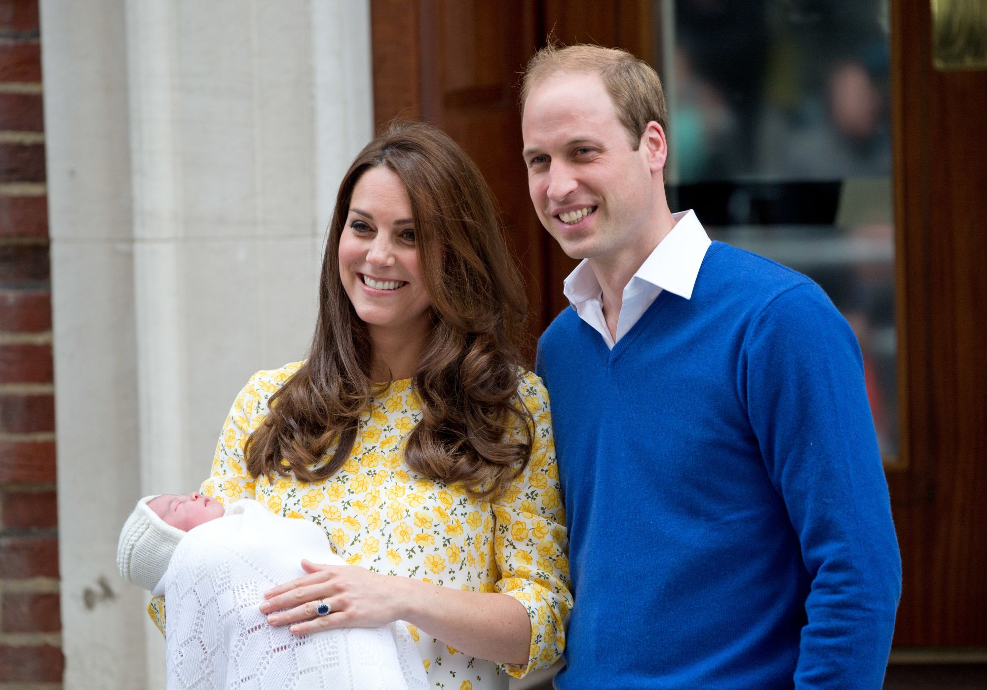 Prince William, Duke of Cambridge and Catherine, Duchess of Cambridge leave the Lindo Wing at St Mary's Hospital in London with their newborn baby daughter, Princess Charlotte of Cambridge (Photo by Zak Hussein/Corbis via Getty Images)