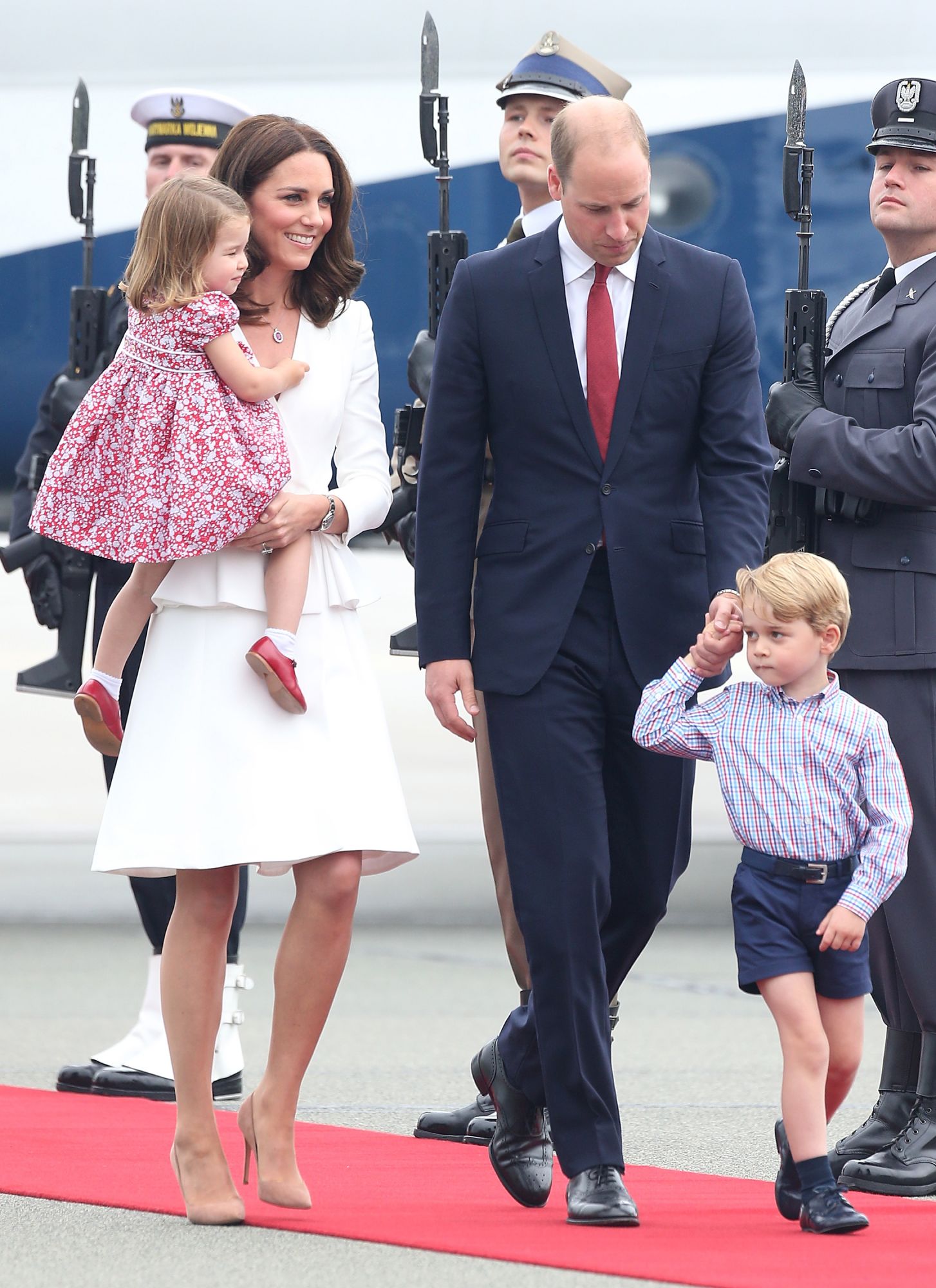 WARSAW, POLAND - JULY 17: Catherine, Duchess of Cambridge, Prince William, Duke of Cambridge, Prince George of Cambridge and Princess Charlotte of Cambridge arrive at the airport during an official visit to Poland and Germany on July 17, 2017 in Warsaw, Poland. (Photo by DMC/GC Images)