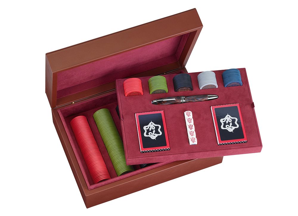 Leather box including poker game set and Special Edition James Purdey & Sons Rollerball inspired by the Britsh lifestyle game tradition.Chips: 60 pieces x 5 colorsDice: 5 poker diceCards: 2 decks of personalized cardsWriting Instrument: Special Edition James Purdey & Sons Rollerball