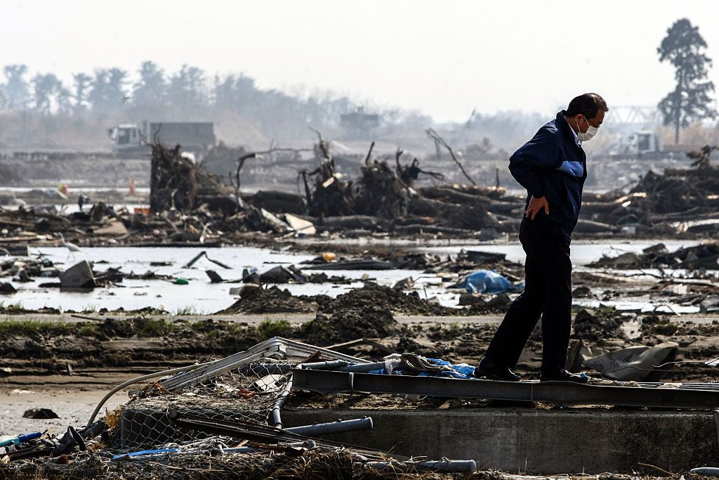 ISHINOMAKI, JAPAN - APRIL 14: Survivor is devastated in Ishinomaki, Miyagi, northern Japan on April 14, 2011. A magnitude 9.0 earthquake and tsunami swept out northeast coast area in Japan on March 11. Japan's Fukushima region transformed from rural haven to ravaged wasteland when the earthquake and tsunami struck in March 2011. (Photo by Hitoshi Yamada/NurPhoto) (Photo by Hitoshi Yamada/NurPhoto/NurPhoto/Corbis via Getty Images)