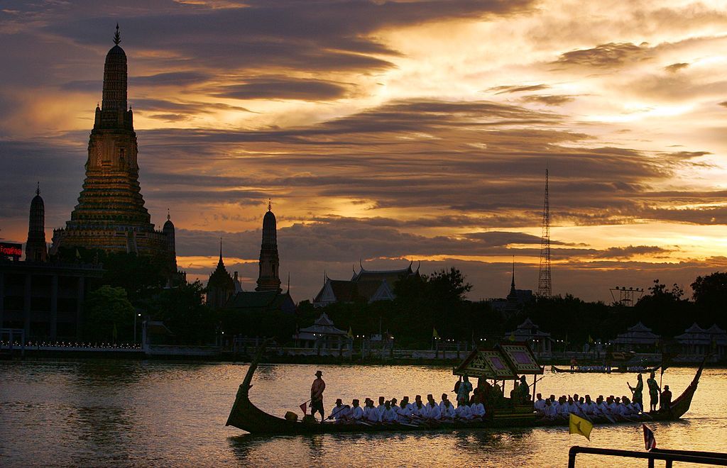 BANGKOK, THAILAND - JUNE 12: The Thai Royal Barge procession cruises down the Chao Praya river celebrating the 60th anniversary celebrations of Thailand King Bhumibol Adulyadej accession to the throne on June 12, 2006 in Bangkok, Thailand. The Royal barges are an ancient Thai tradition displayed for the foreign monarchs who have come to join the celebrations. (Photo by Paula Bronstein /Getty Images)