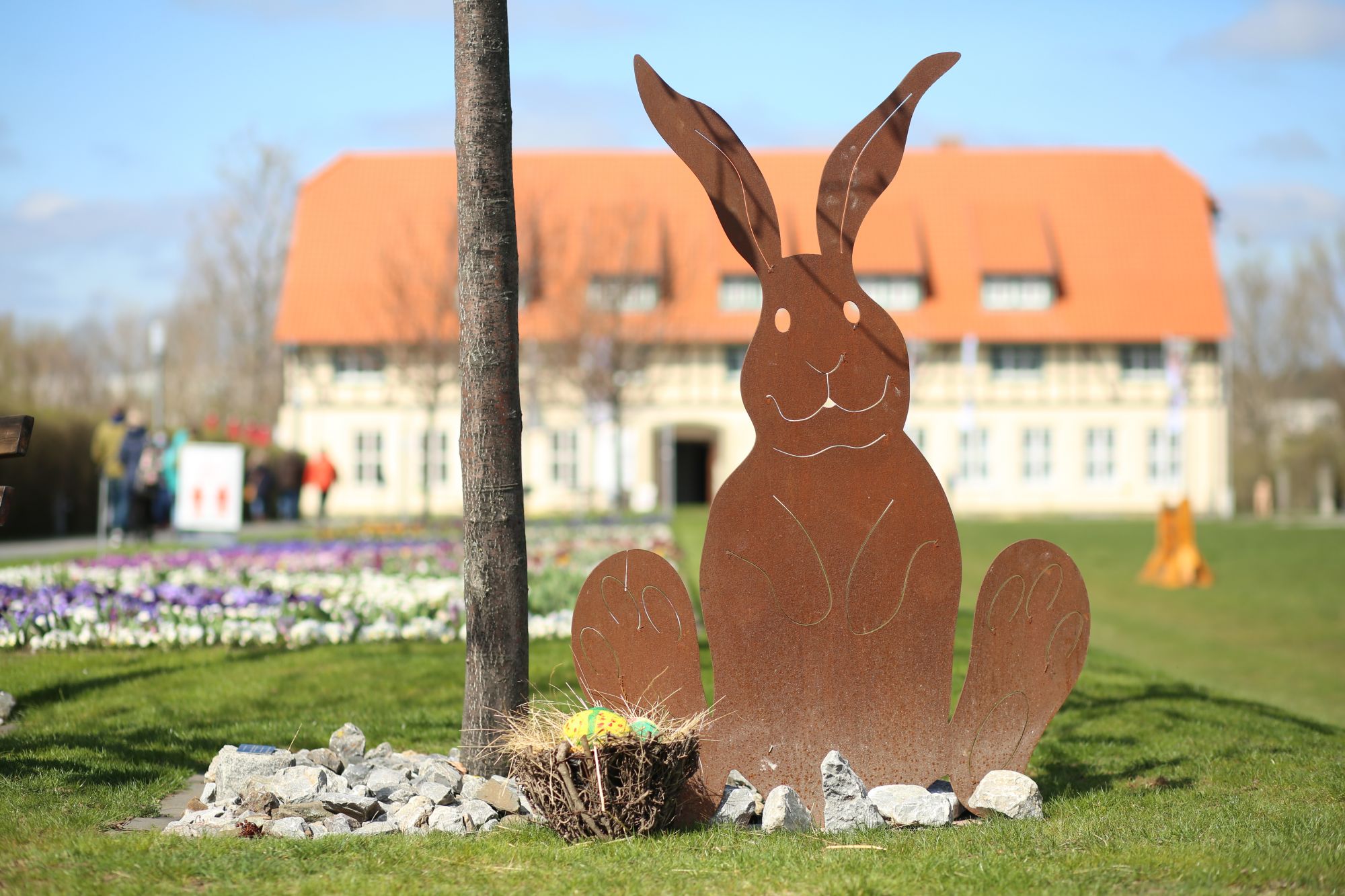 02 April 2021, Saxony-Anhalt, Wernigerode: An Easter bunny figure stands in the miniature park "Kleiner Harz". The miniature park opened its doors today after the winter break. In the upcoming season, events are still planned, but only a few dates are fixed, because the operators want to wait for the further development of the Corona pandemic. Photo: Matthias Bein/dpa-Zentralbild/dpa (Photo by Matthias Bein/picture alliance via Getty Images)