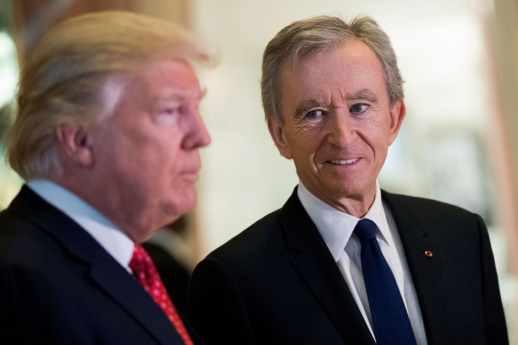 NEW YORK, NY - JANUARY 9: (L to R) President-elect Donald Trump and French businessman Bernard Arnault, chief executive officer of LVMH, speak to reporters at Trump Tower, January 9, 2017 in New York City. President-elect Donald Trump and his transition team are in the process of filling cabinet and other high level positions for the new administration. (Photo by Drew Angerer/Getty Images)