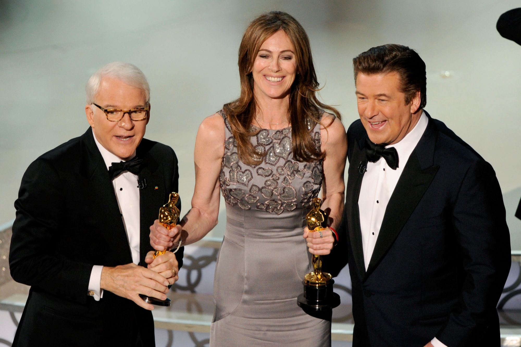 HOLLYWOOD, CA - MARCH 07: Director Kathryn Bigelow onstage with co-hosts Steve Martin and Alec Baldwin during the 82nd Annual Academy Awards held at Kodak Theatre on March 7, 2010 in Hollywood, California. (Photo by Michael Caulfield/WireImage)